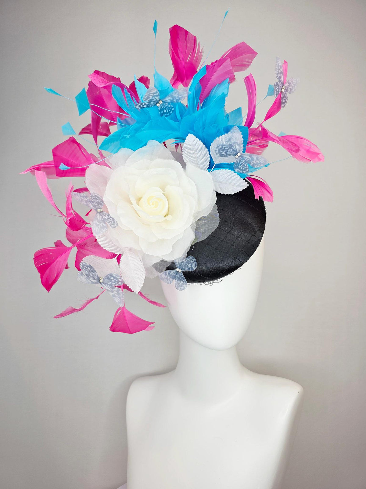 kentucky derby hat fascinator black satin with netting ivory white organza rose white leaves pink sky blue feathers light gray butterflies