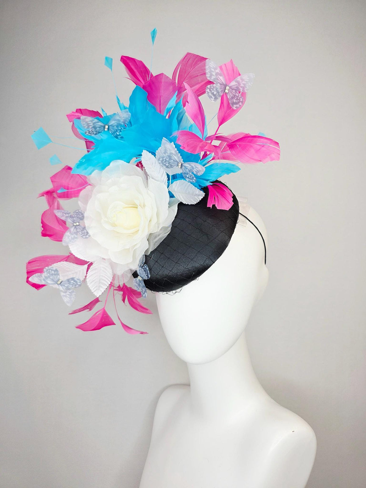 kentucky derby hat fascinator black satin with netting ivory white organza rose white leaves pink sky blue feathers light gray butterflies