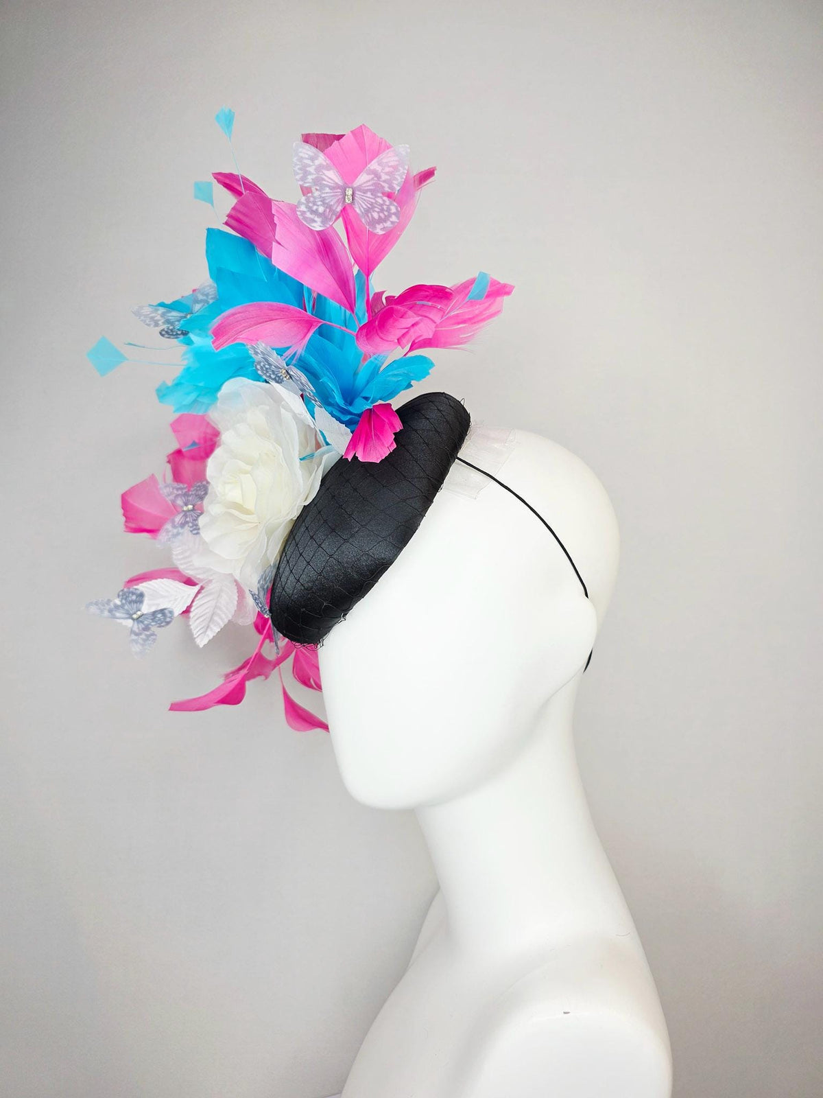 kentucky derby hat fascinator black satin with netting ivory white organza rose white leaves pink sky blue feathers light gray butterflies