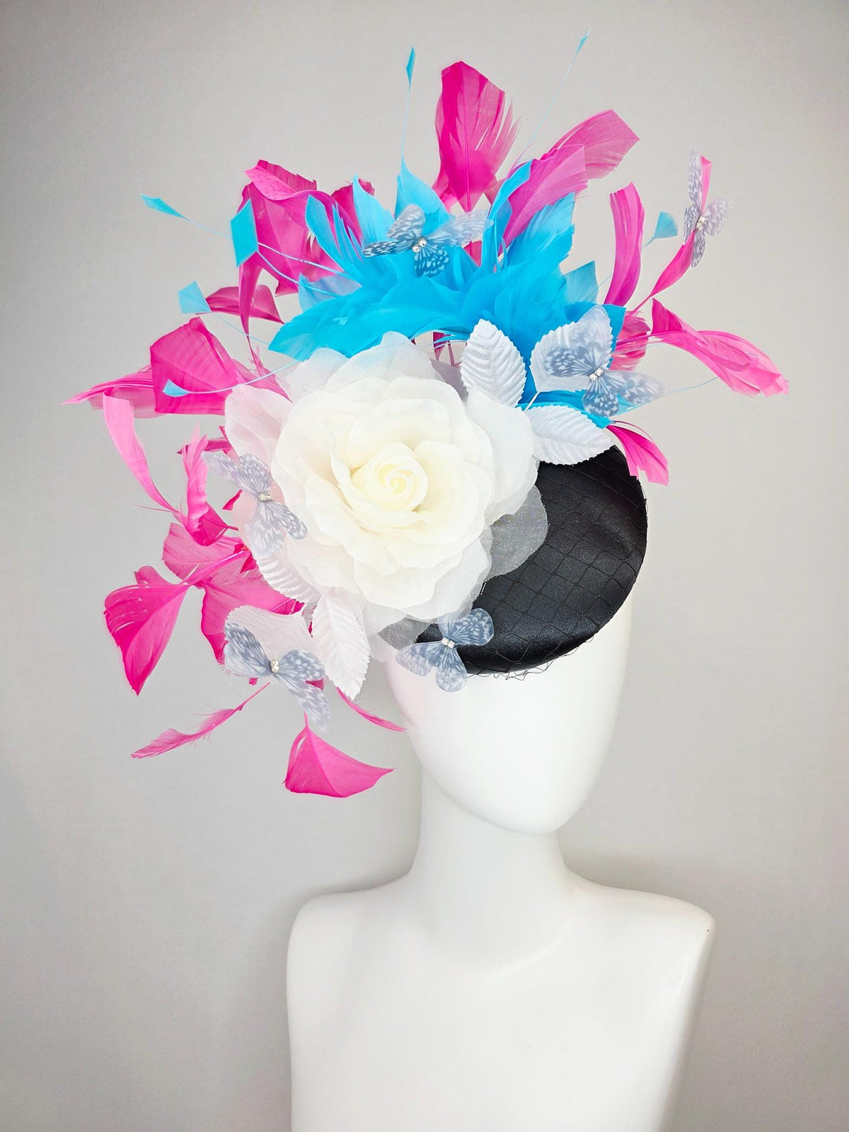kentucky derby hat fascinator black satin with netting ivory white organza rose white leaves pink sky blue feathers light gray butterflies