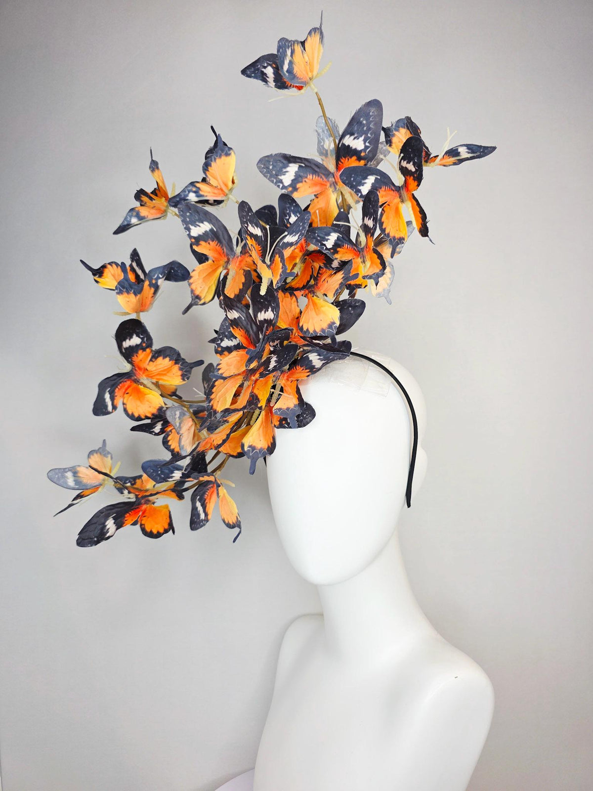 kentucky derby hat fascinator large branching warm burnt orange yellow black and white fabric butterflies on headband