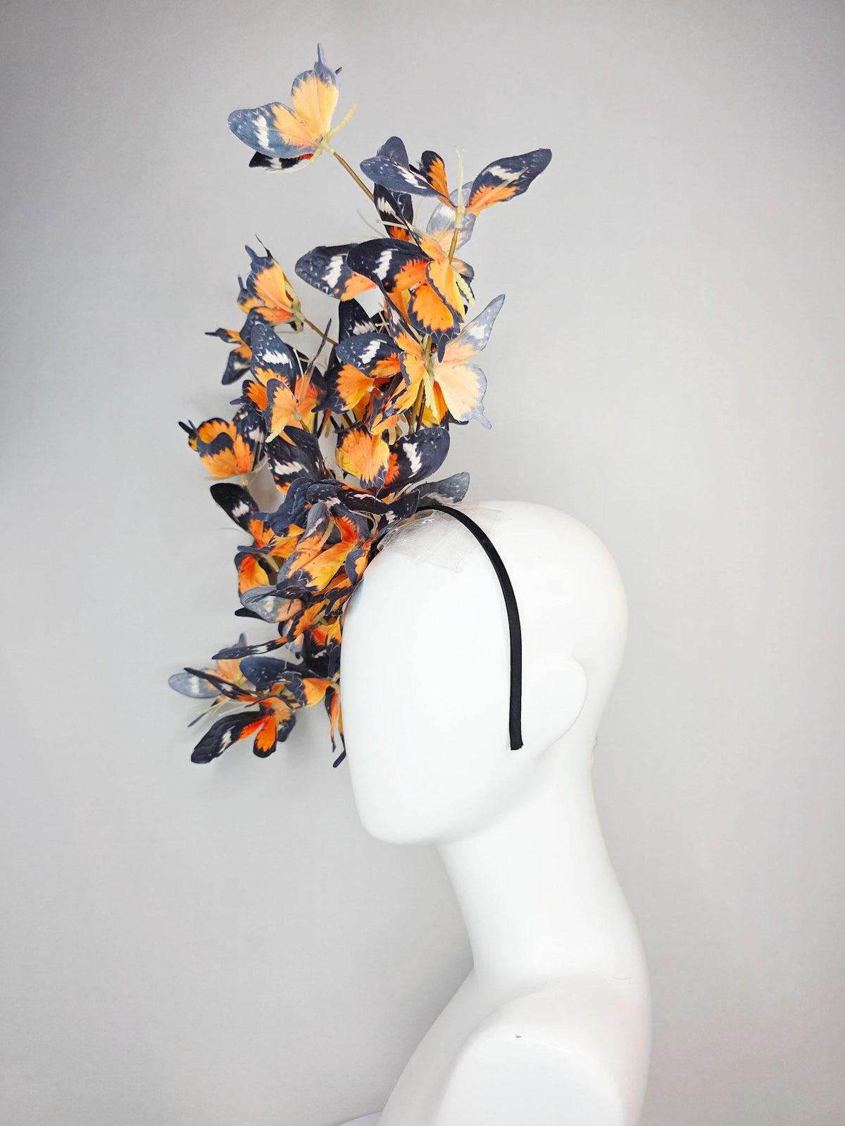 kentucky derby hat fascinator large branching warm burnt orange yellow black and white fabric butterflies on headband