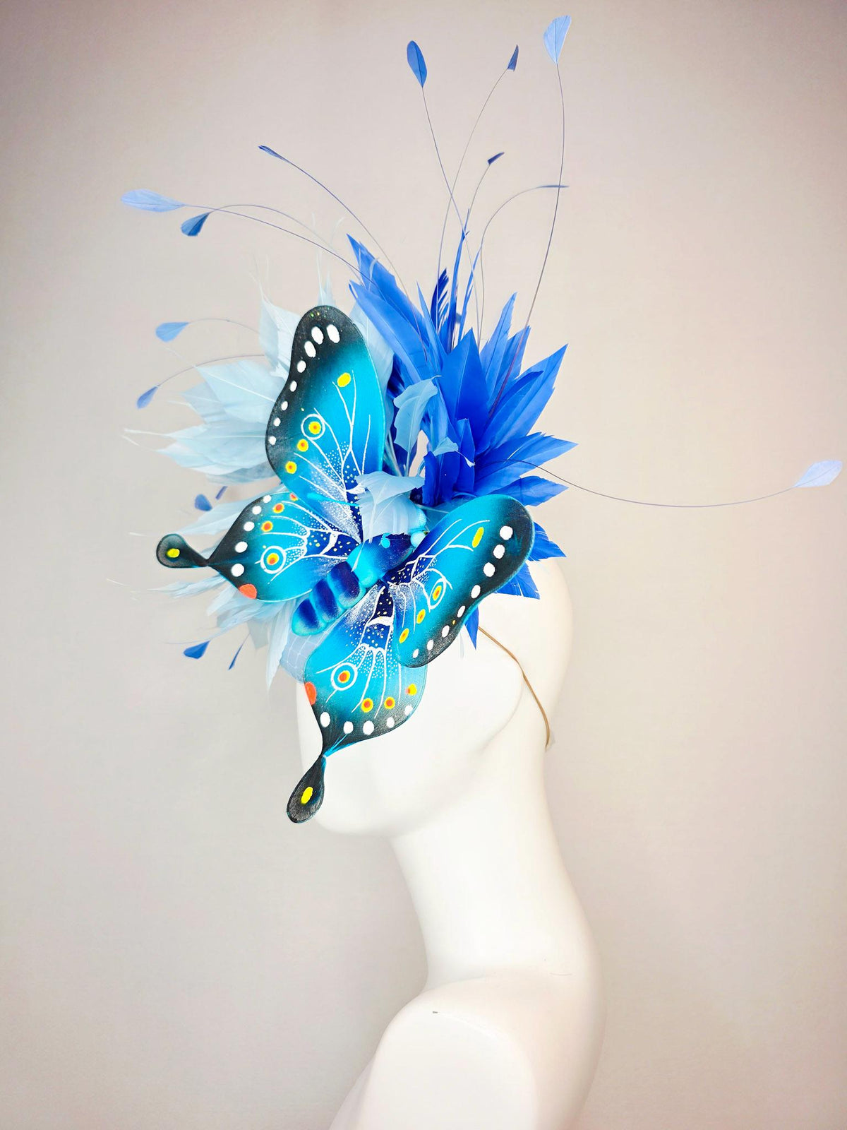 kentucky derby hat fascinator baby blue satin with netting light blue cobalt blue branching feathers large turquoise blue black butterfly