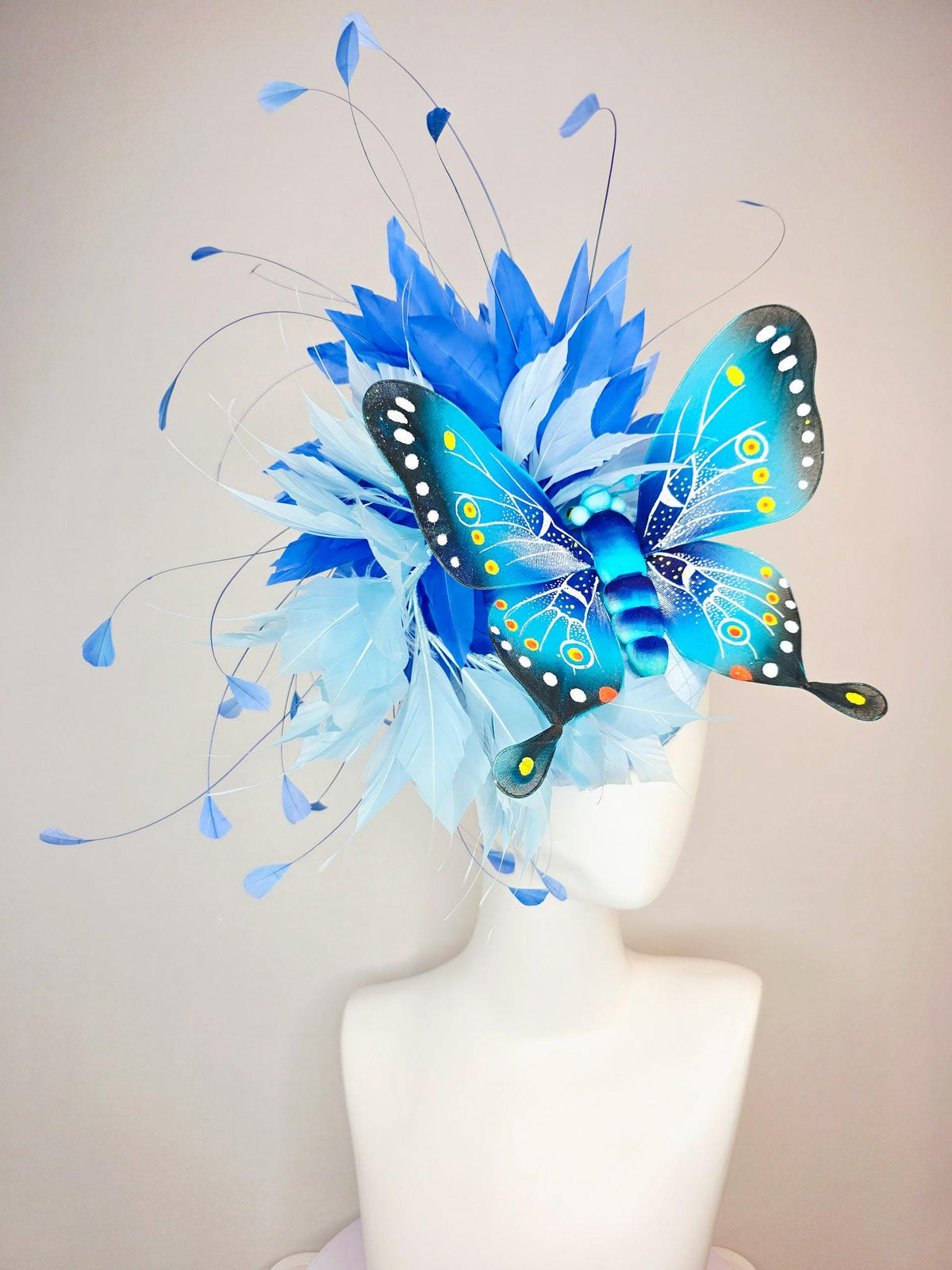 kentucky derby hat fascinator baby blue satin with netting light blue cobalt blue branching feathers large turquoise blue black butterfly