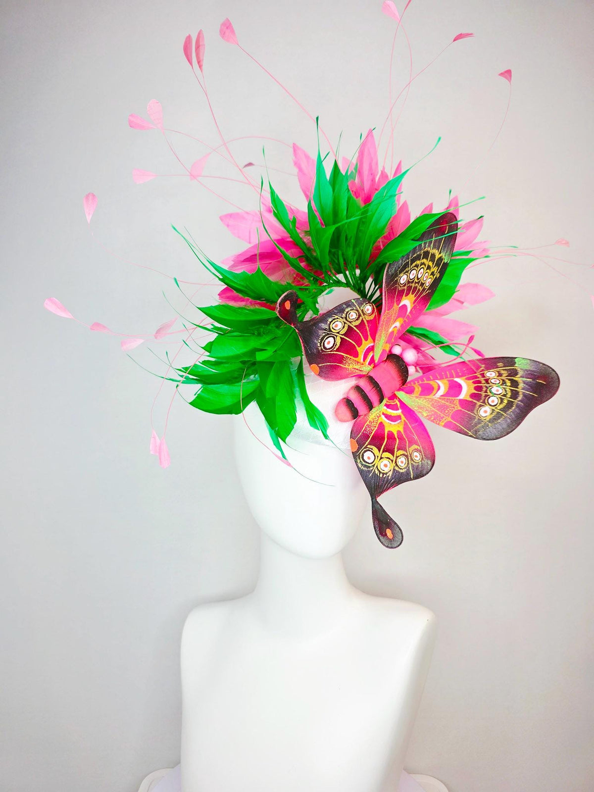 kentucky derby hat fascinator white satin with netting emerald green and hot pink branching feathers with large pink yellow black butterfly