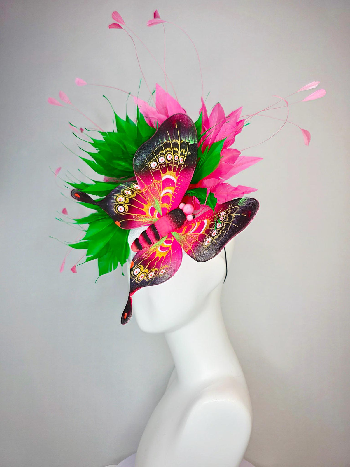 kentucky derby hat fascinator white satin with netting emerald green and hot pink branching feathers with large pink yellow black butterfly