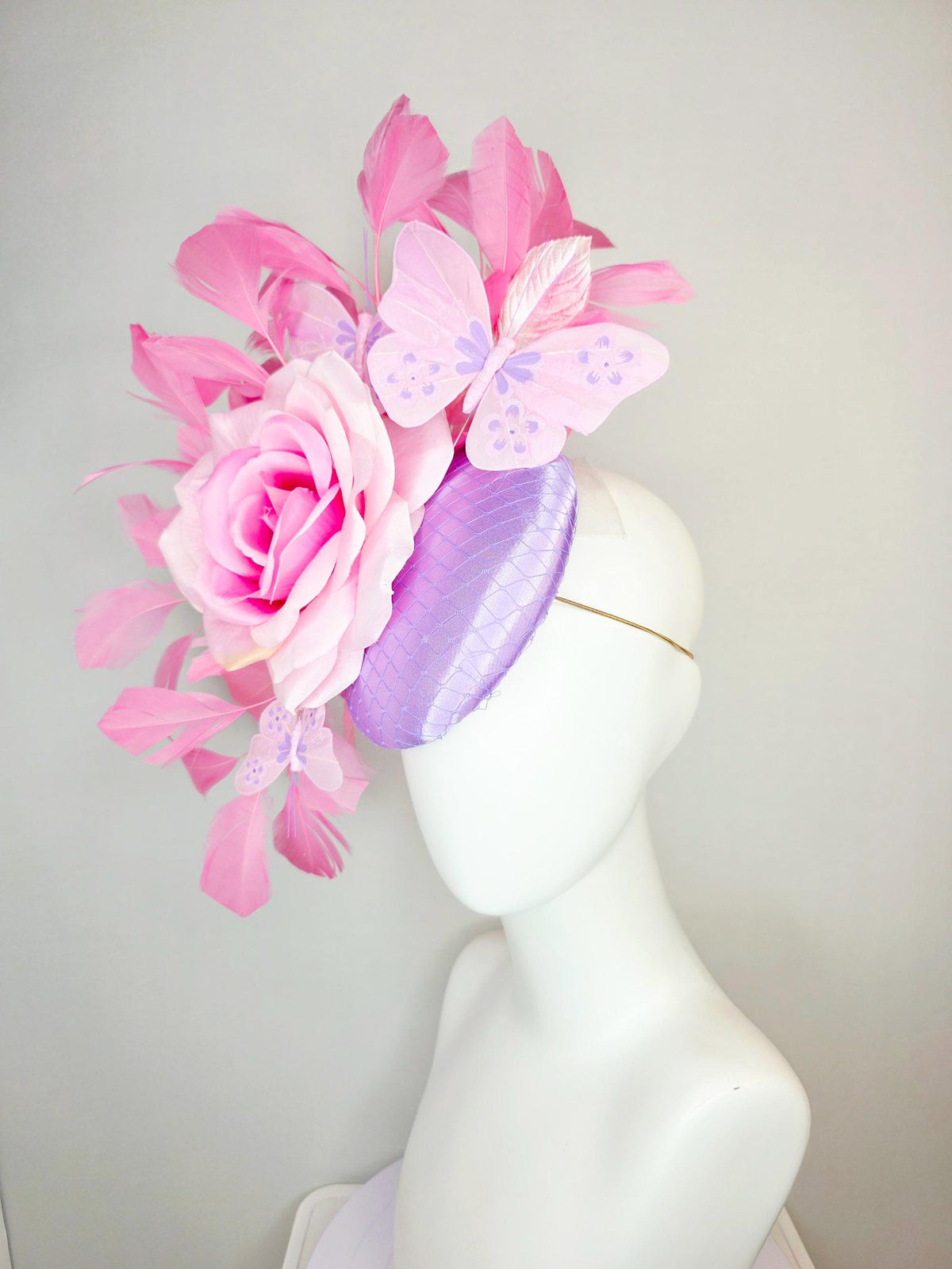 kentucky derby hat fascinator lavender purple satin with netting ombre pink satin rose light pink leaves blush pink feathers and butterflies