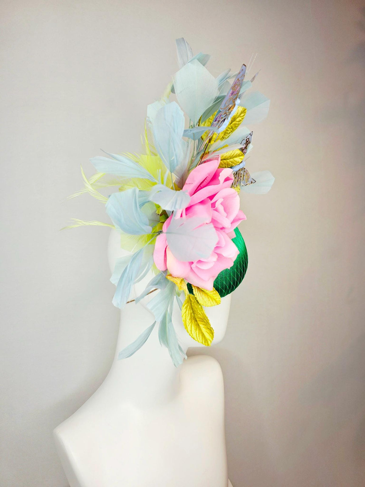 kentucky derby hat fascinator emerald green satin with netting blush pink satin rose lime yellow leaves gray blue feathers gold butterflies