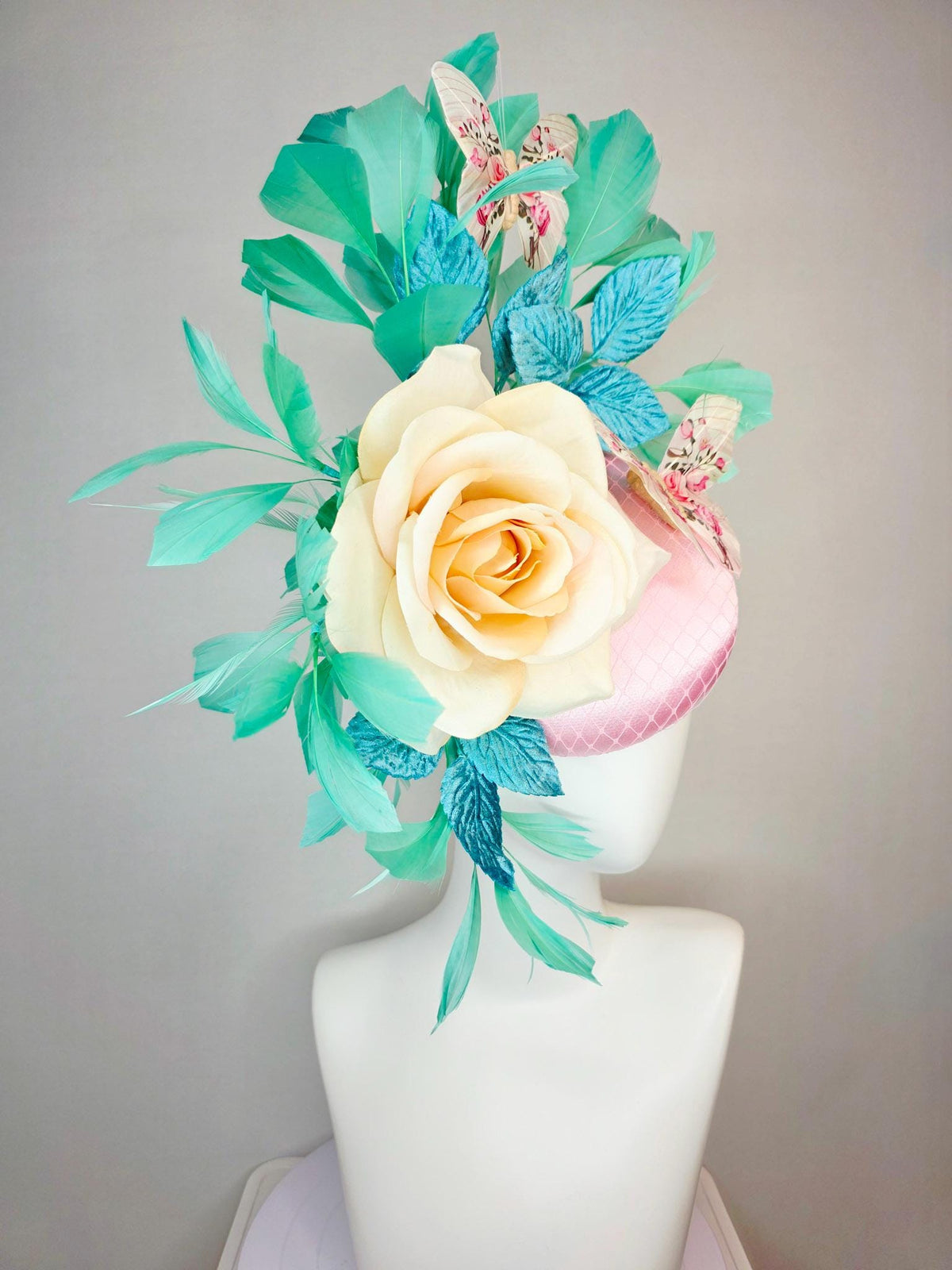 kentucky derby hat fascinator light pink satin with netting ivory cream satin rose turquoise blue leaves mint green feathers and butterflies