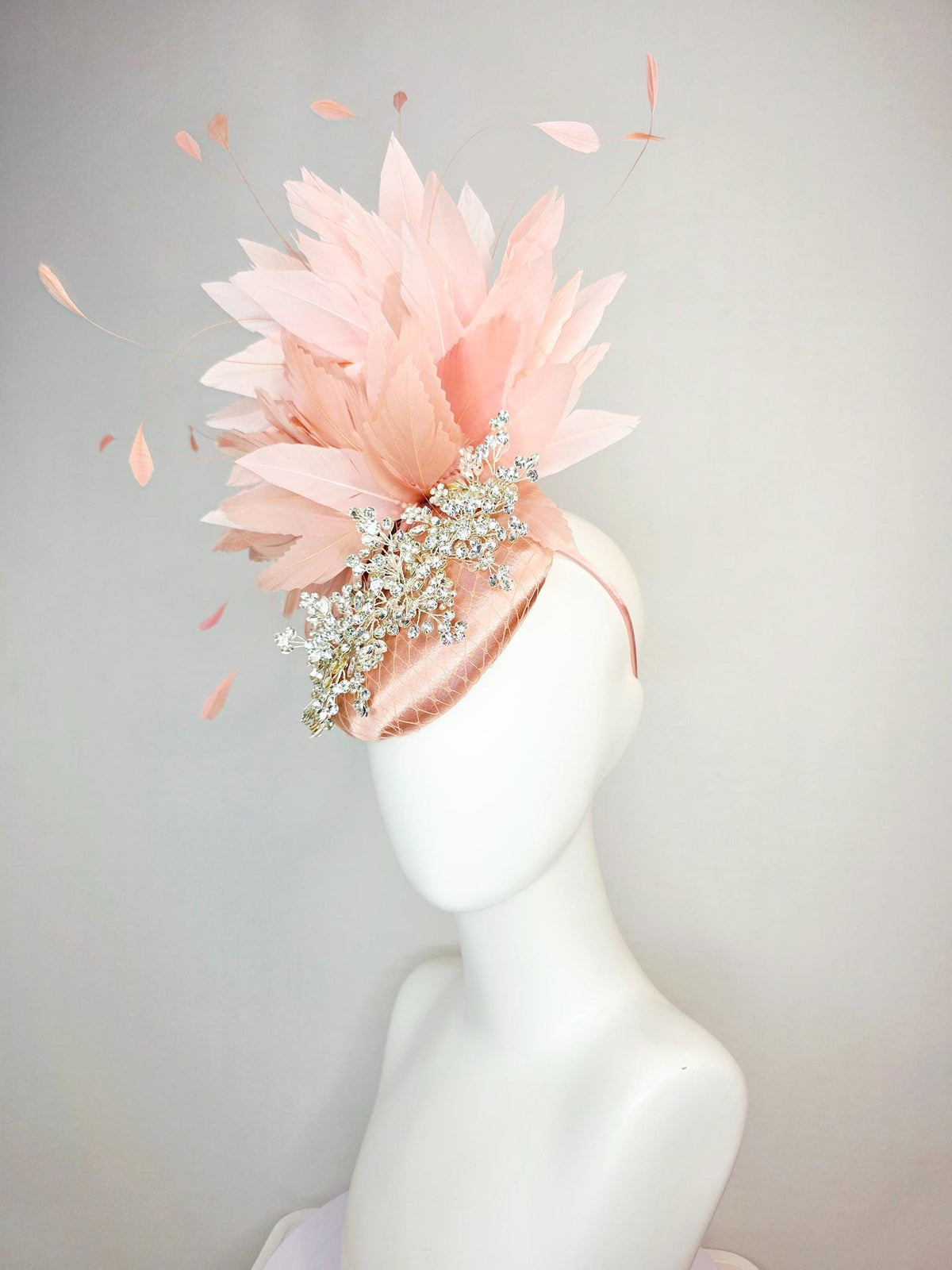 kentucky derby hat fascinator champagne pink satin with netting leaf vine clear crystal rhinestone light dusty pale mauve pink feathers