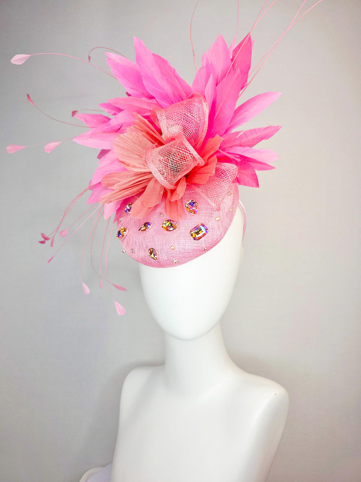 kentucky derby hat fascinator light pink sinamay iridescent pink crystal rhinestone jewels light pink bow peach orange blush pink feathers