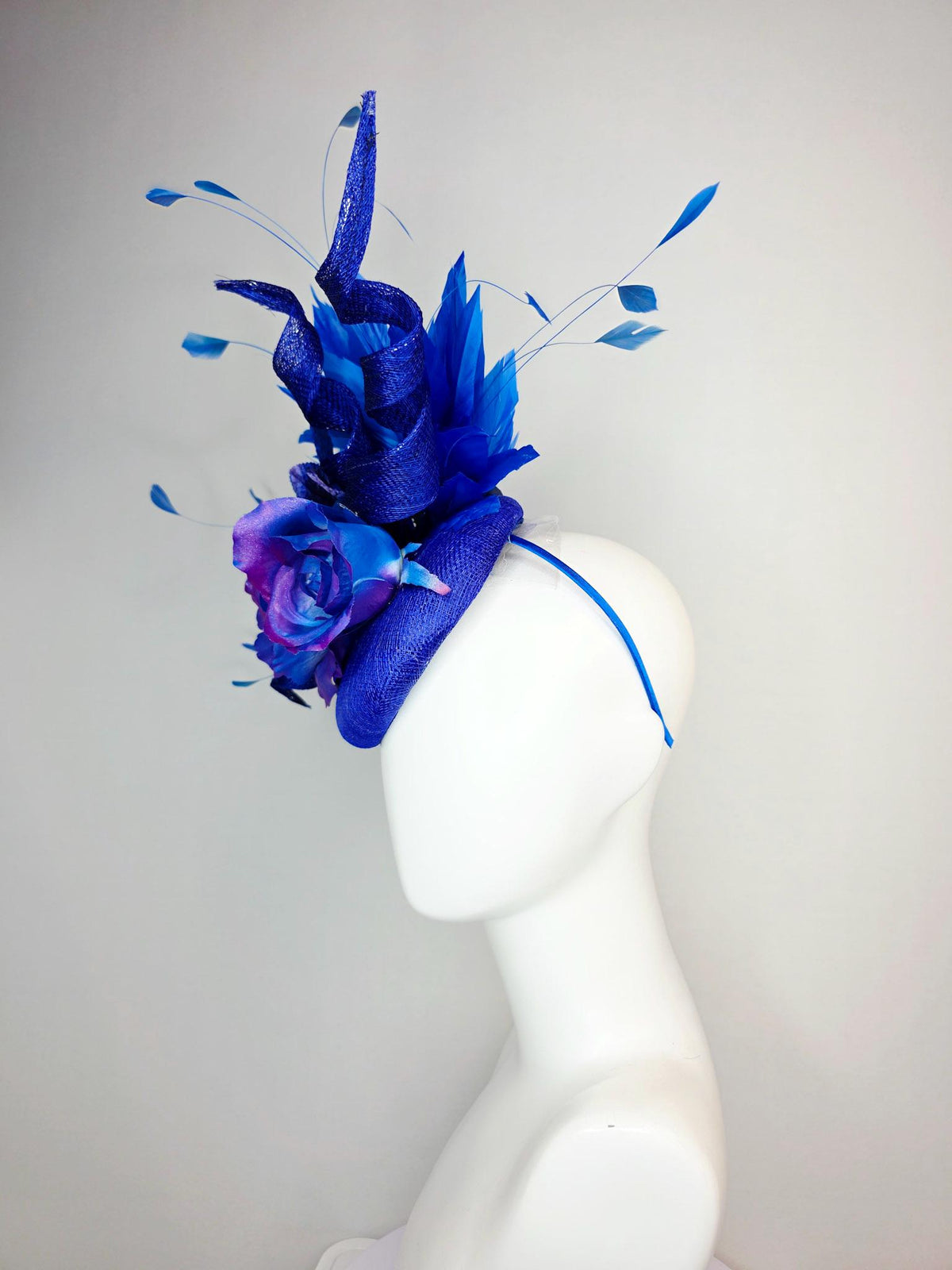 kentucky derby hat fascinator cobalt blue sinamay with curls ombre pink purple blue satin roses blue leaves royal blue branching feathers