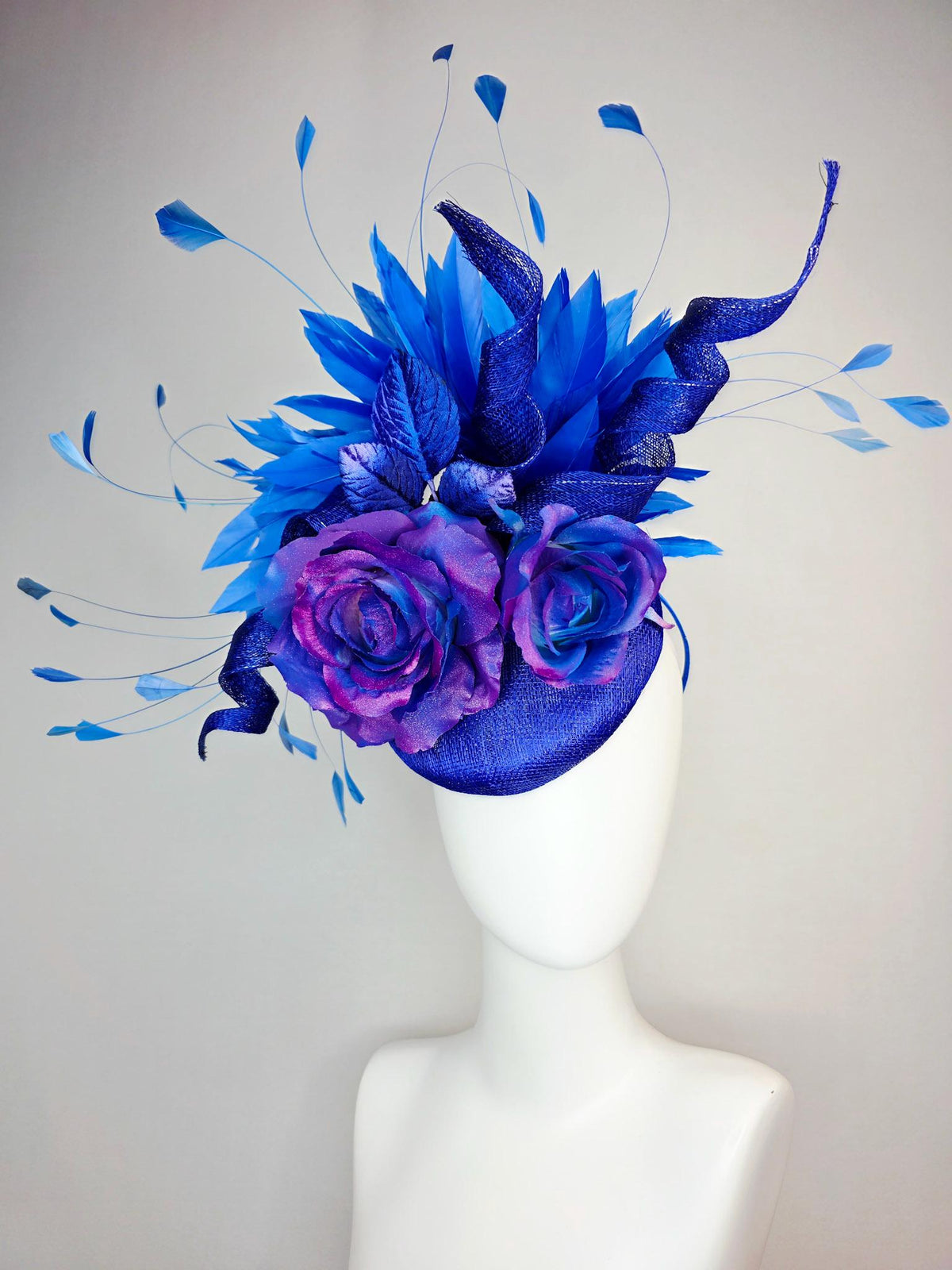 kentucky derby hat fascinator cobalt blue sinamay with curls ombre pink purple blue satin roses blue leaves royal blue branching feathers