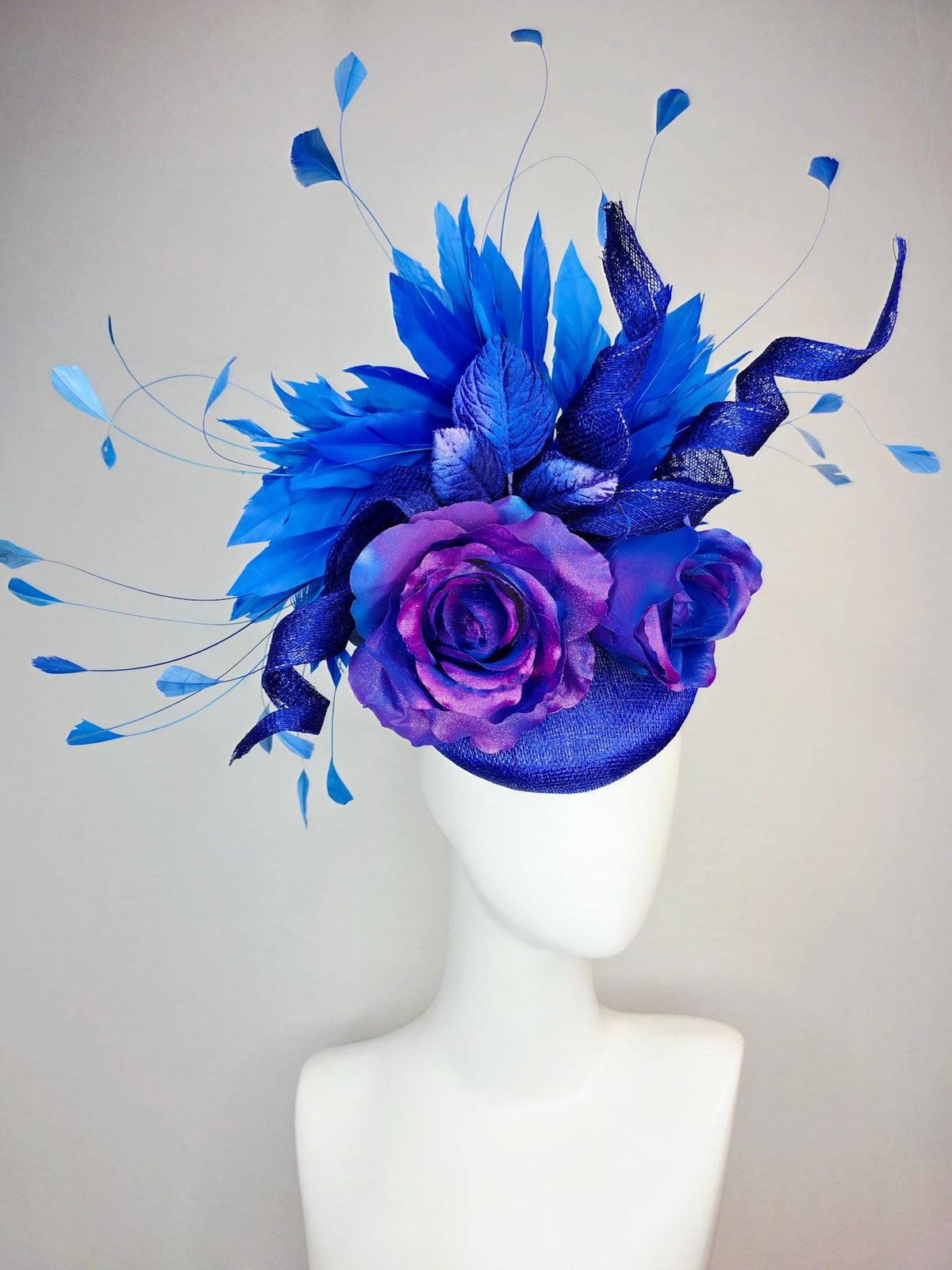 kentucky derby hat fascinator cobalt blue sinamay with curls ombre pink purple blue satin roses blue leaves royal blue branching feathers