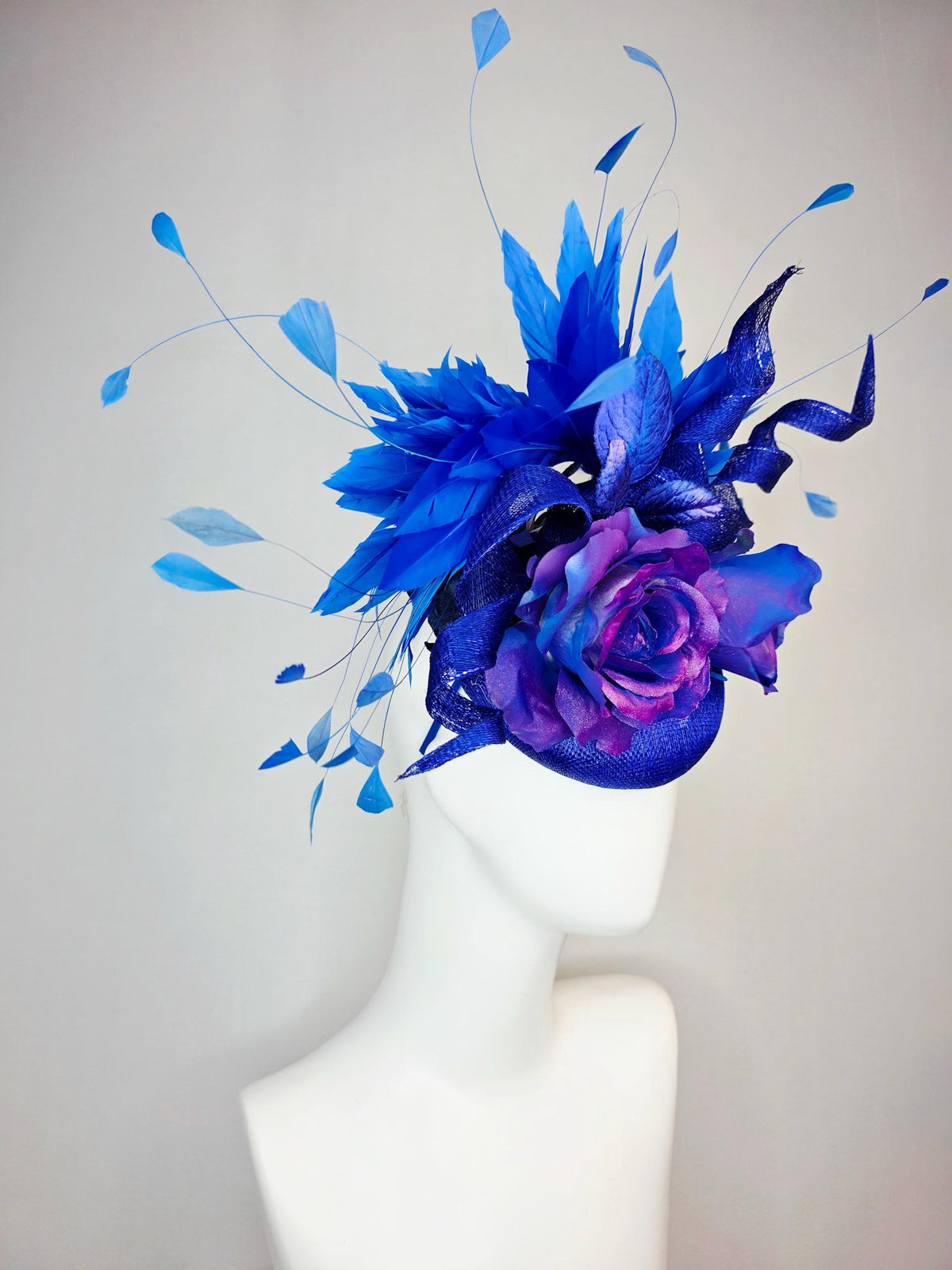 kentucky derby hat fascinator cobalt blue sinamay with curls ombre pink purple blue satin roses blue leaves royal blue branching feathers