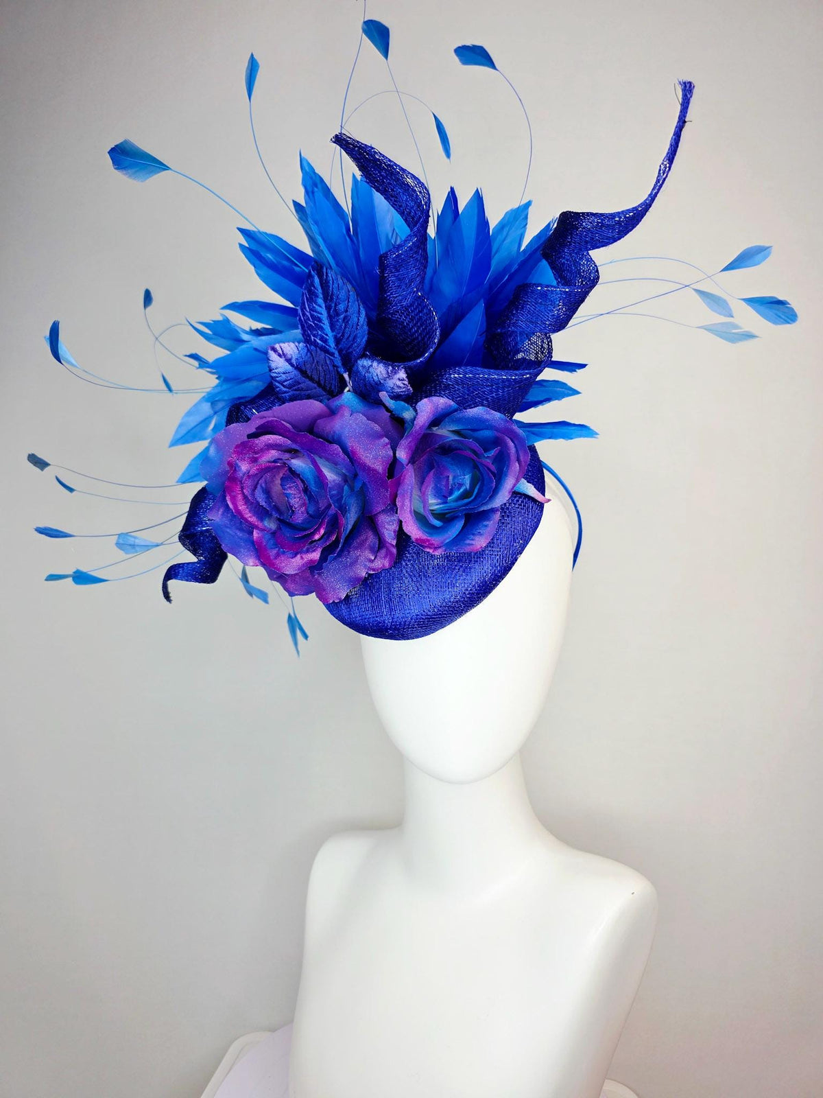 kentucky derby hat fascinator cobalt blue sinamay with curls ombre pink purple blue satin roses blue leaves royal blue branching feathers