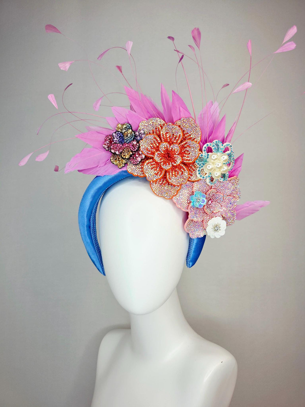kentucky derby hat fascinator sky blue satin headband with iridescent pink orange blue gold pearl crystal flowers and blush pink feathers
