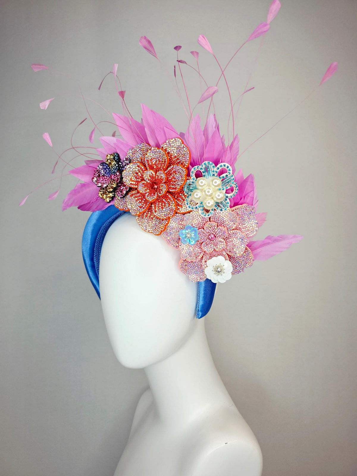 kentucky derby hat fascinator sky blue satin headband with iridescent pink orange blue gold pearl crystal flowers and blush pink feathers
