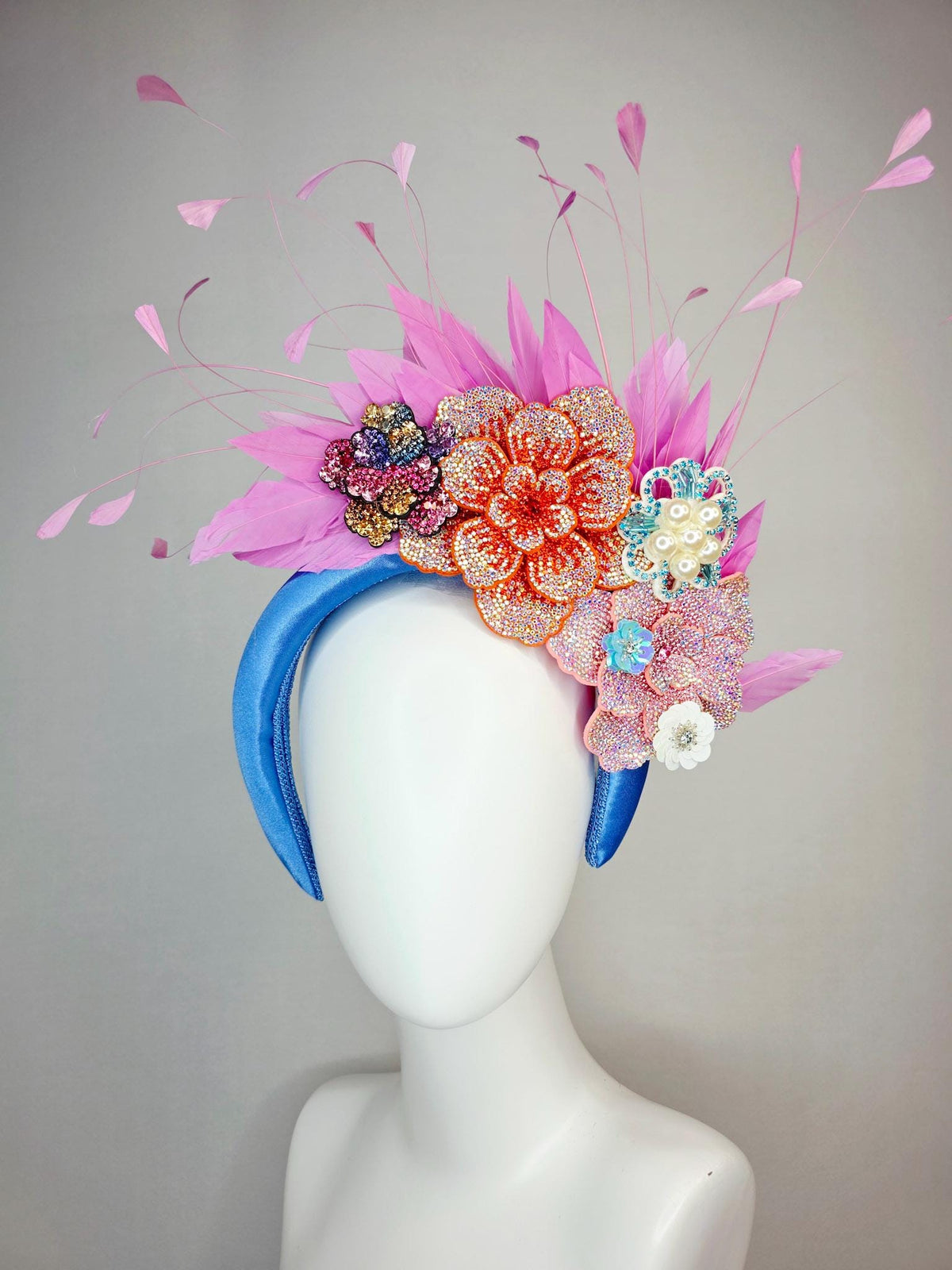 kentucky derby hat fascinator sky blue satin headband with iridescent pink orange blue gold pearl crystal flowers and blush pink feathers