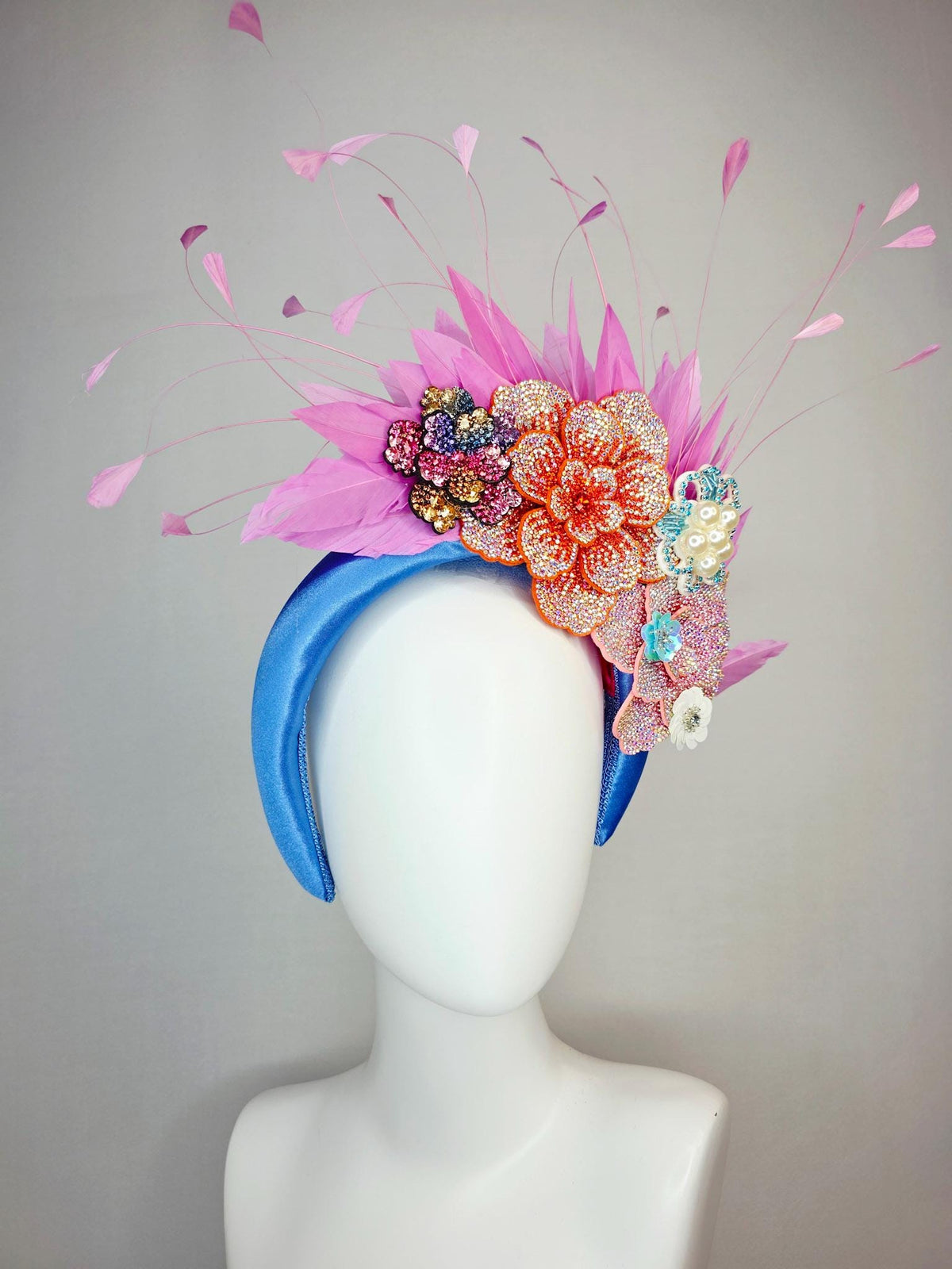 kentucky derby hat fascinator sky blue satin headband with iridescent pink orange blue gold pearl crystal flowers and blush pink feathers