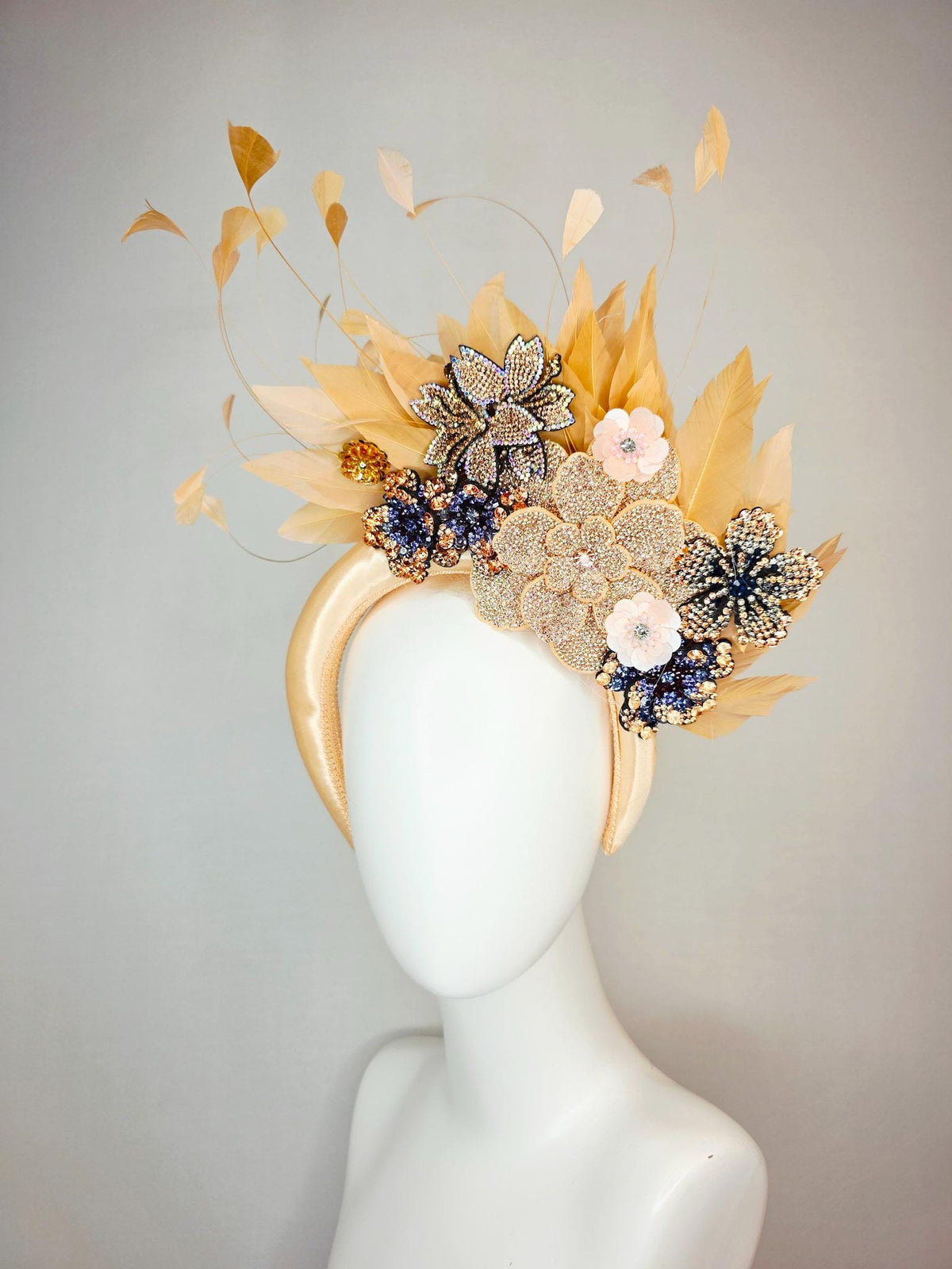 kentucky derby hat fascinator champagne gold satin headband with navy blue gold ivory crystal rhinestone flowers and tan beige gold feathers
