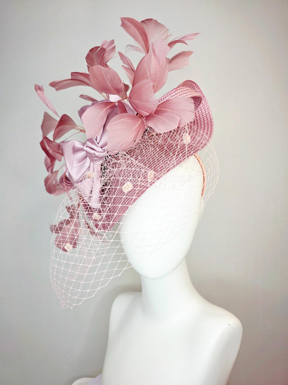 kentucky derby hat fascinator dusty mauve pink straw saucer with lilac pink satin bow dusty pink branching feathers light pink mesh veil