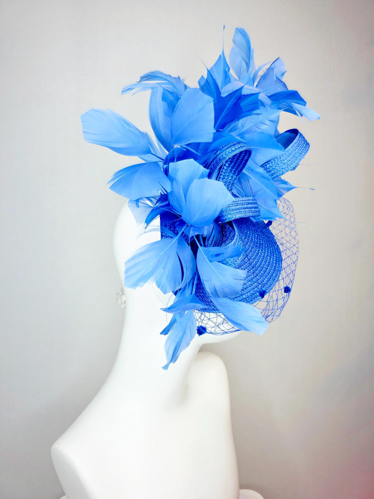 kentucky derby hat fascinator cobalt blue straw saucer with cobalt blue straw bow royal blue feathers and cobalt blue mesh veil
