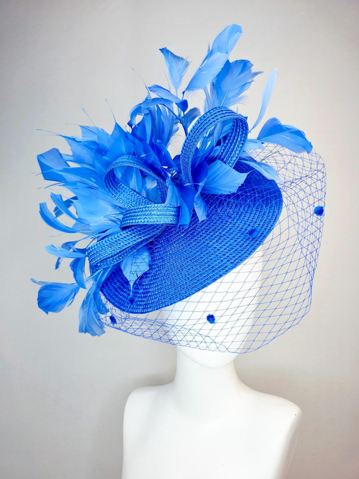 kentucky derby hat fascinator cobalt blue straw saucer with cobalt blue straw bow royal blue feathers and cobalt blue mesh veil