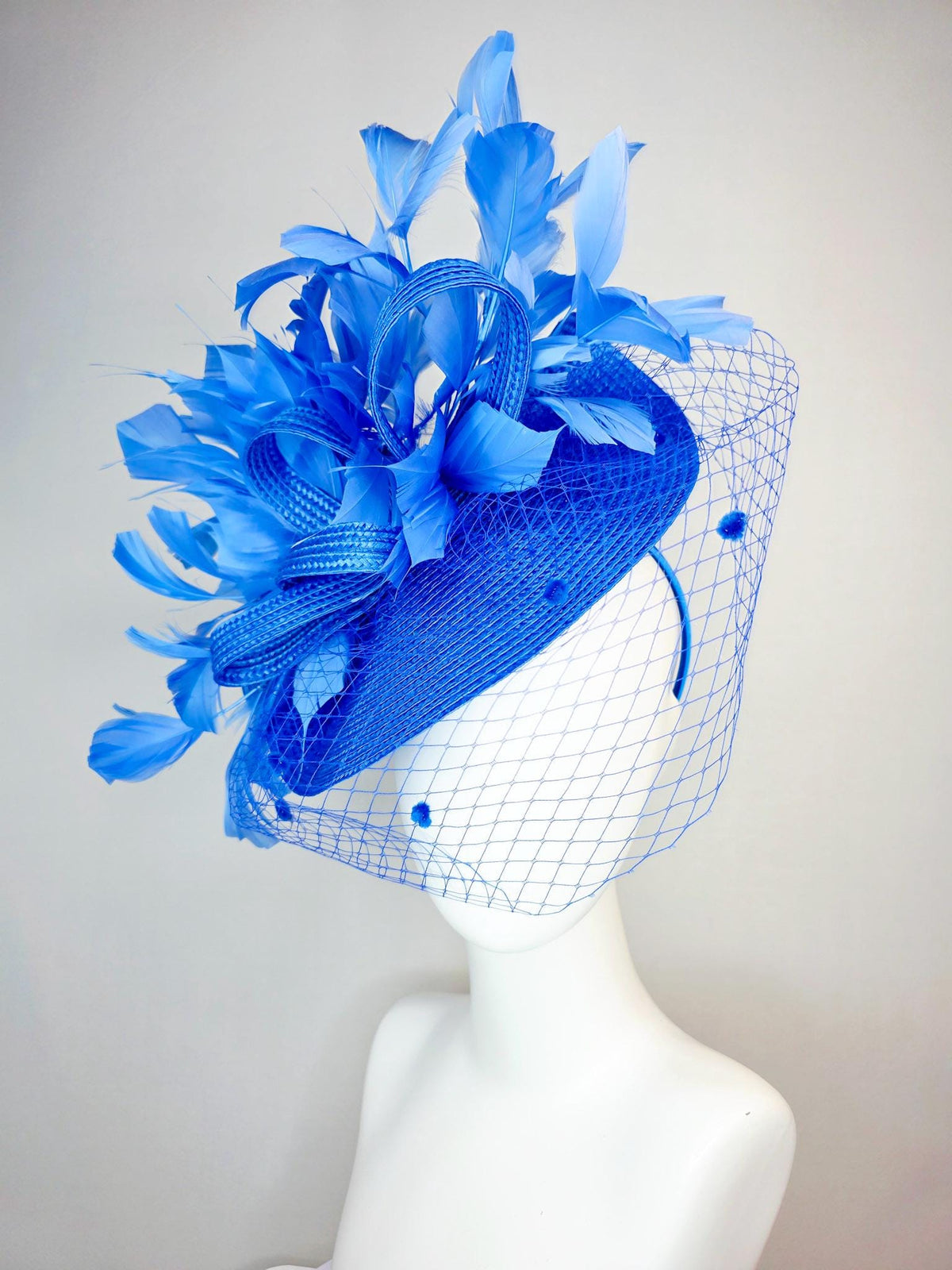kentucky derby hat fascinator cobalt blue straw saucer with cobalt blue straw bow royal blue feathers and cobalt blue mesh veil