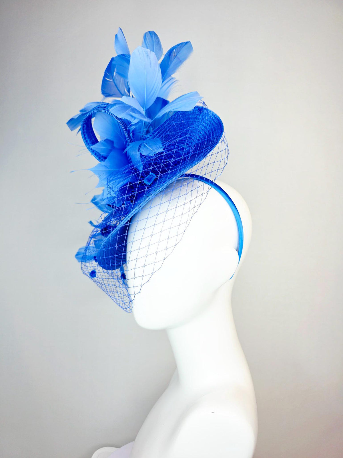 kentucky derby hat fascinator cobalt blue straw saucer with cobalt blue straw bow royal blue feathers and cobalt blue mesh veil