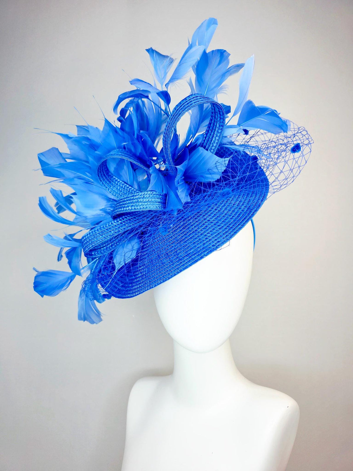 kentucky derby hat fascinator cobalt blue straw saucer with cobalt blue straw bow royal blue feathers and cobalt blue mesh veil