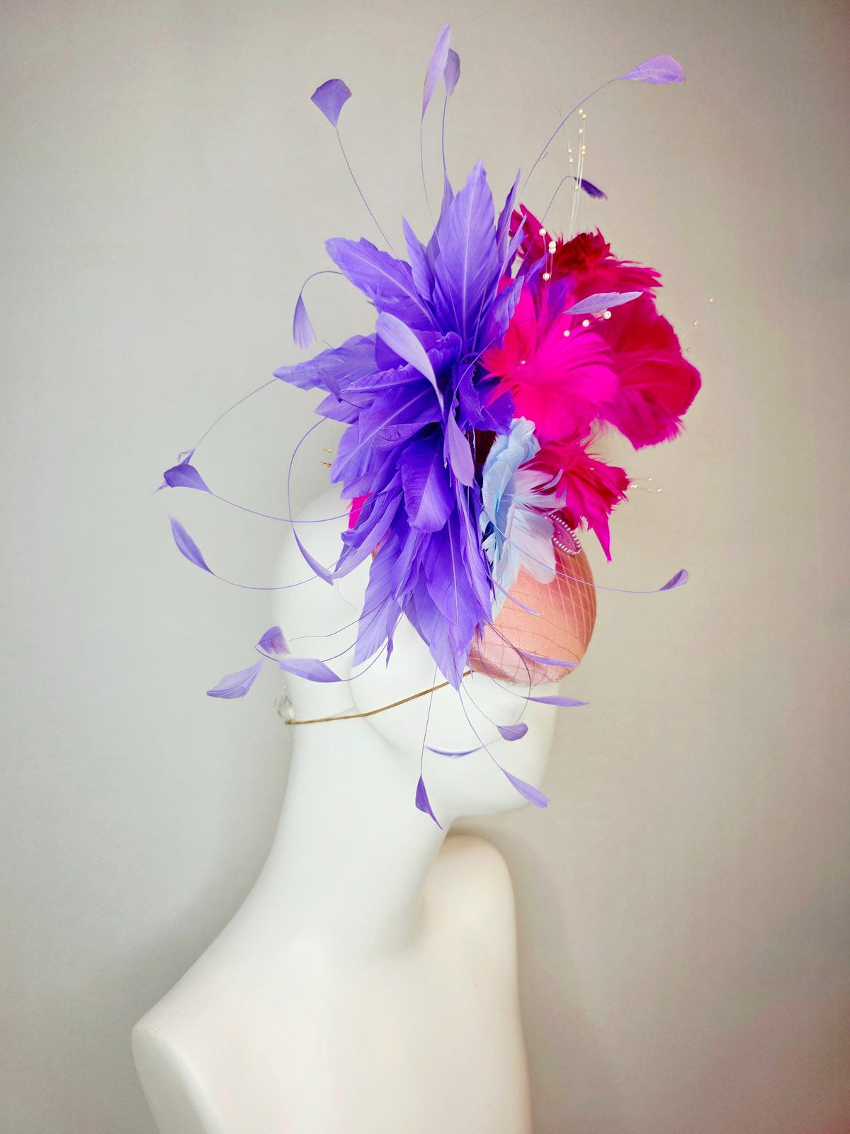 kentucky derby hat fascinator dusty pink satin with netting light blue fuchsia pink feather flowers white leaves lavender purple feathers