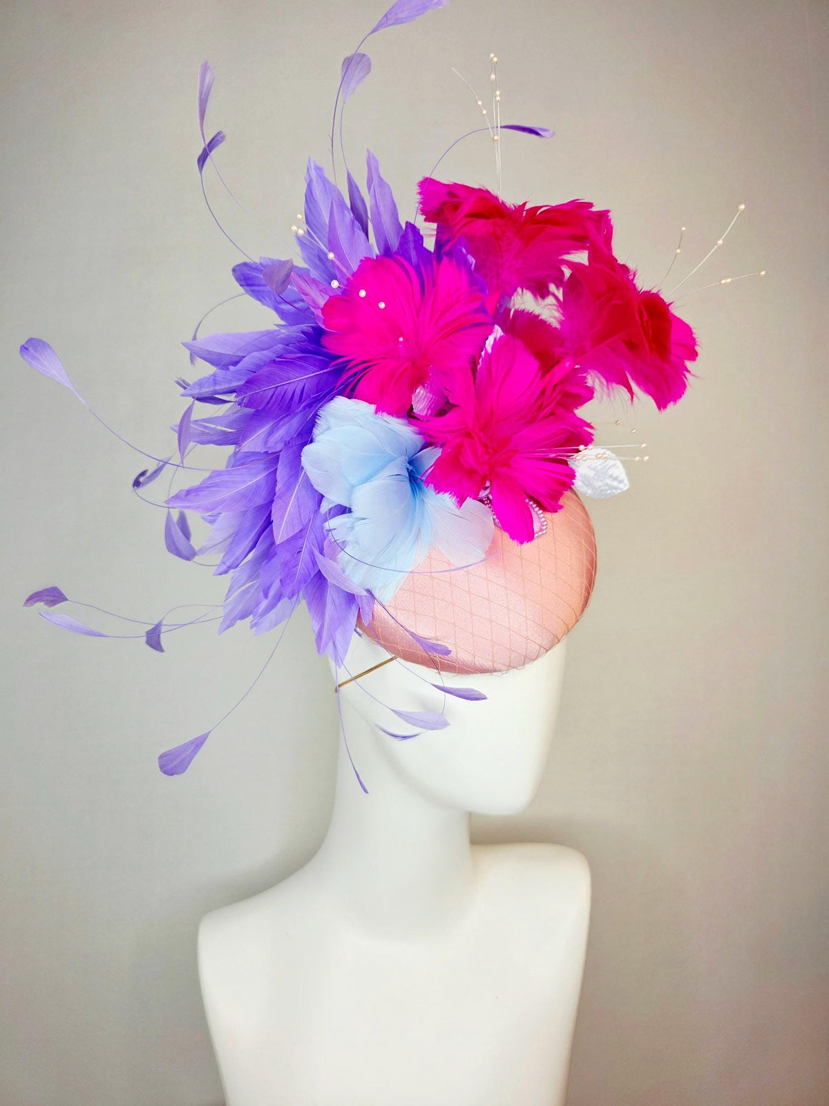 kentucky derby hat fascinator dusty pink satin with netting light blue fuchsia pink feather flowers white leaves lavender purple feathers