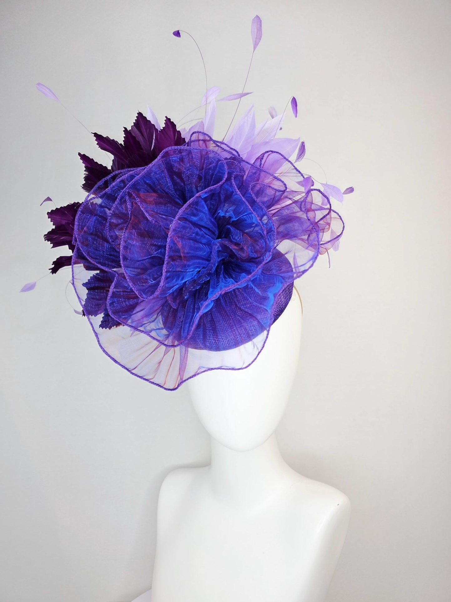 kentucky derby hat fascinator purple sinamay with large purple blue organza flower lavender and violet purple branching feathers