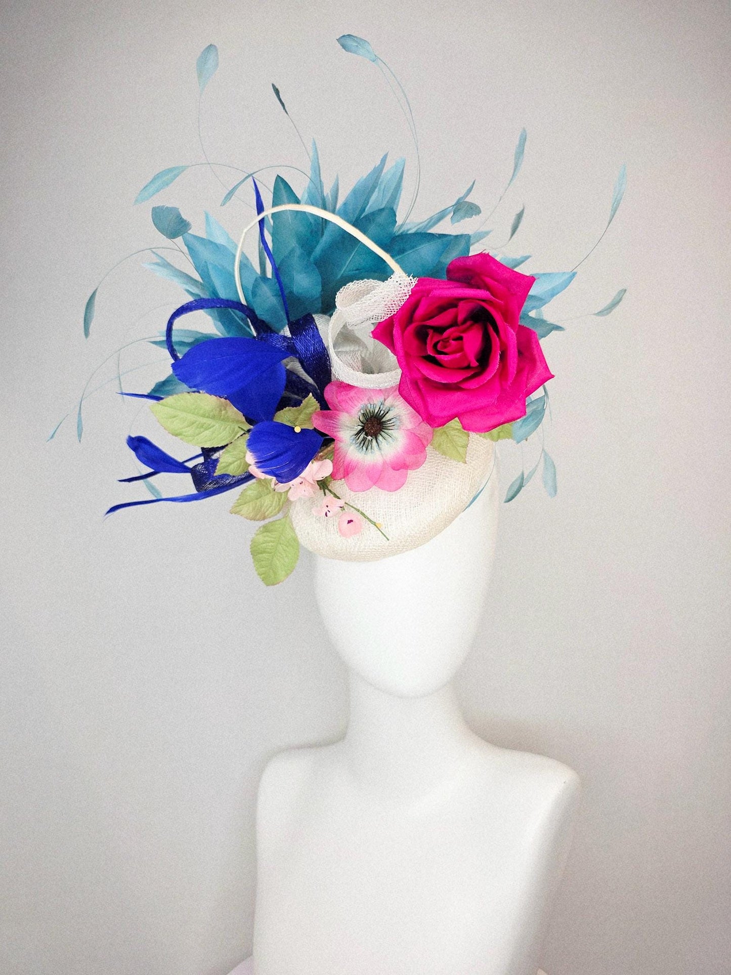 kentucky derby hat fascinator white sinamay with curls fuchsia satin rose and pink flowers light green leaves and cobalt teal blue feathers