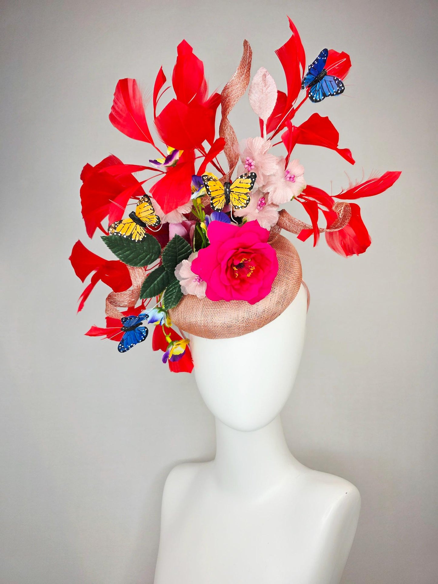 kentucky derby hat fascinator champagne pink sinamay fuchsia satin rose light pink flowers green leaves red feathers blue yellow butterflies