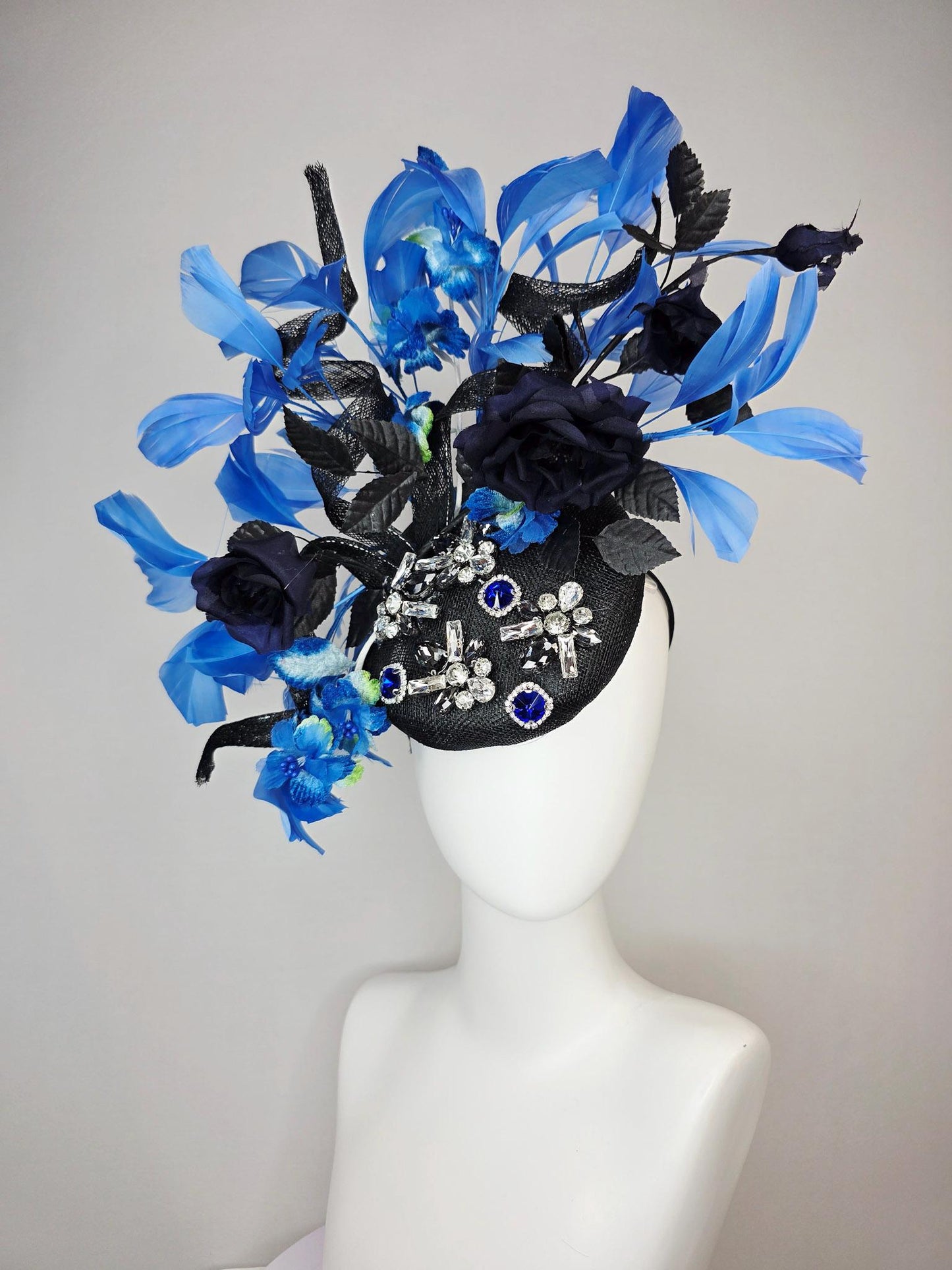 kentucky derby hat fascinator black sinamay with curls blue and clear crystal jewels navy blue satin roses black leaves royal blue feathers