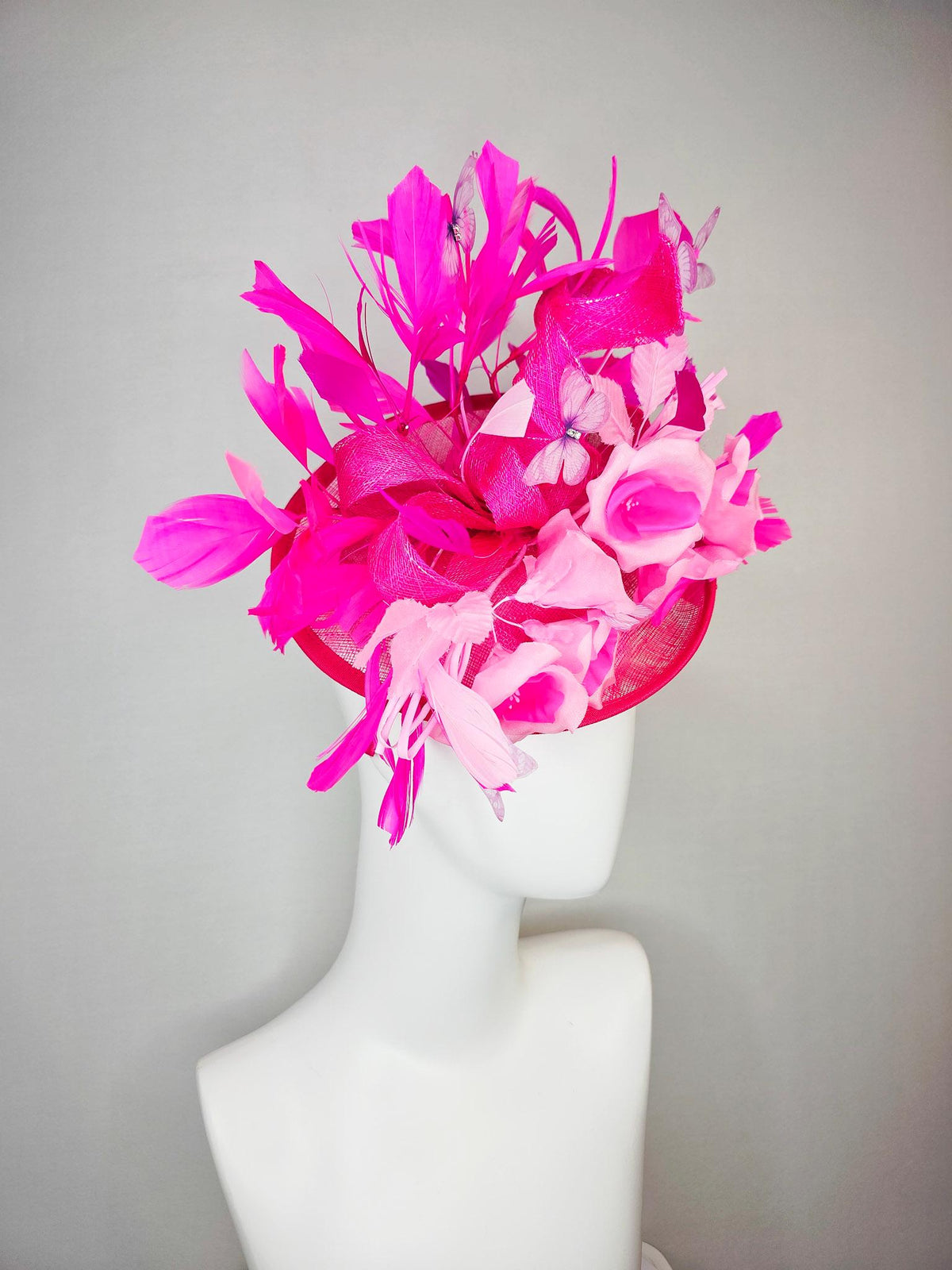 kentucky derby hat fascinator hot pink sinamay saucer blush pink satin flowers light pink leaves bright pink fuchsia feathers butterflies