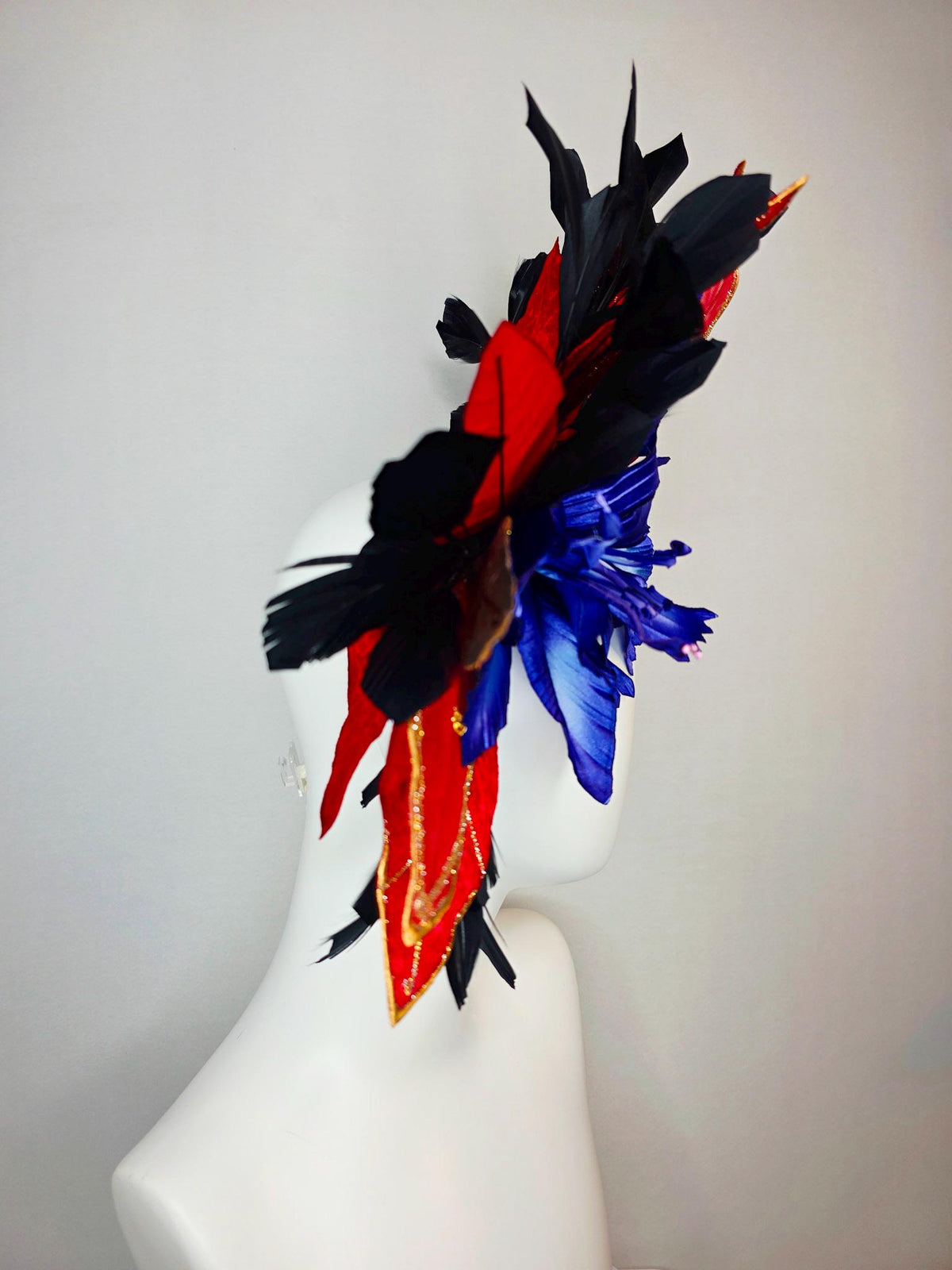 kentucky derby hat fascinator large royal blue satin flower red and gold organza satin leaves black branching feathers gold pearl butterfly
