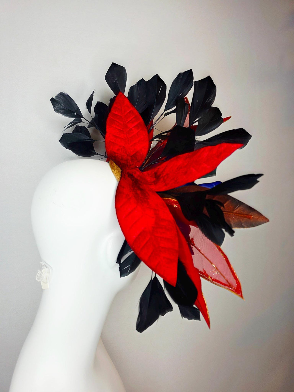 kentucky derby hat fascinator large royal blue satin flower red and gold organza satin leaves black branching feathers gold pearl butterfly