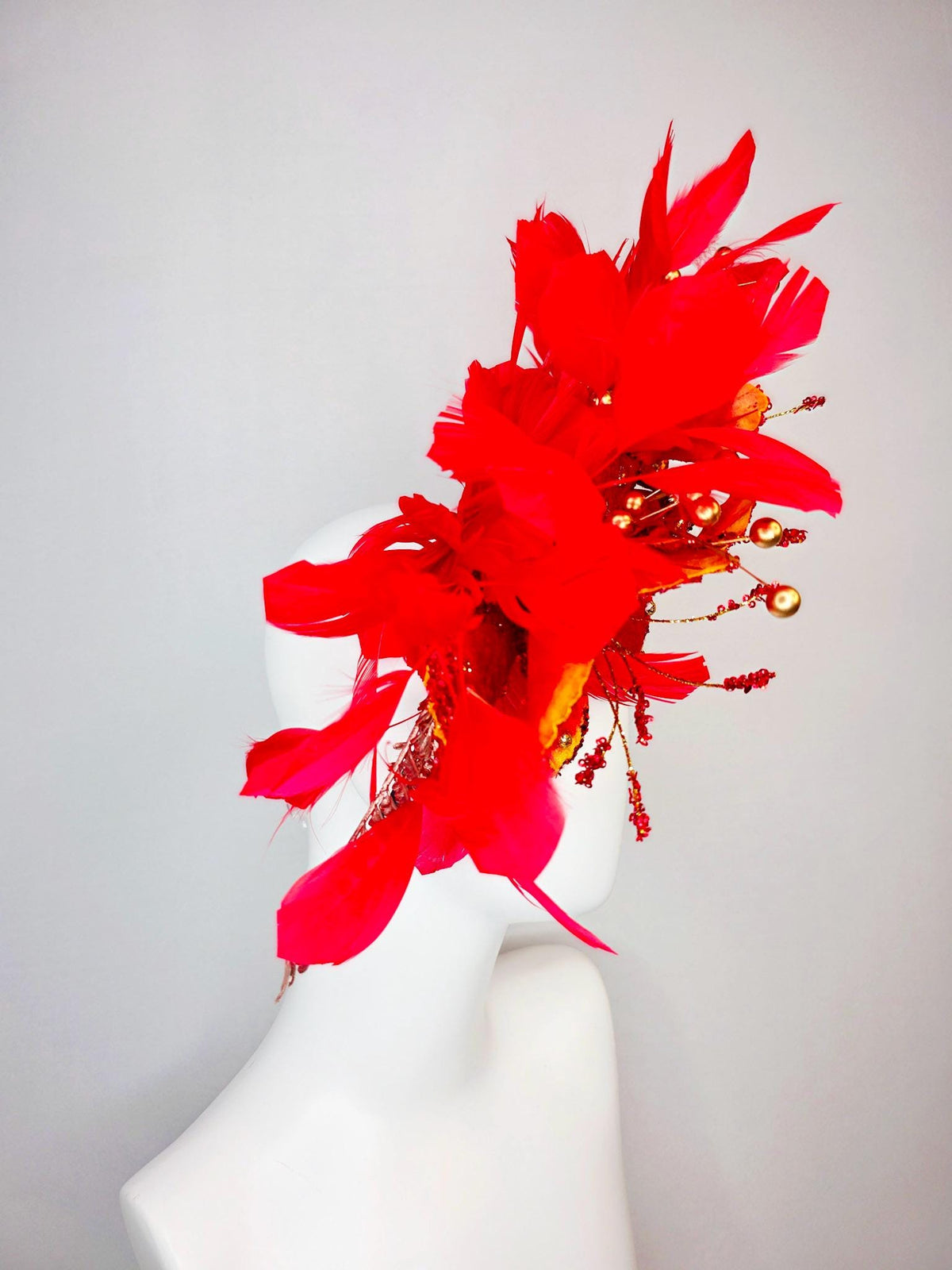 kentucky derby hat fascinator scarlet red and yellow with red sequin satin flowers bright red branching feathers and gold pearl stems