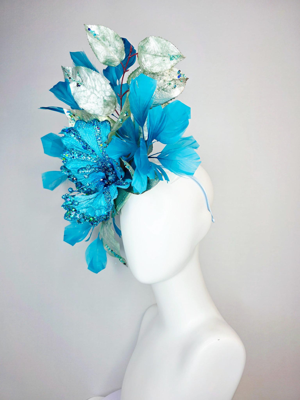 kentucky derby hat fascinator large with sky ocean blue satin flower with sequin silver sage green leaves turquoise blue branching feathers