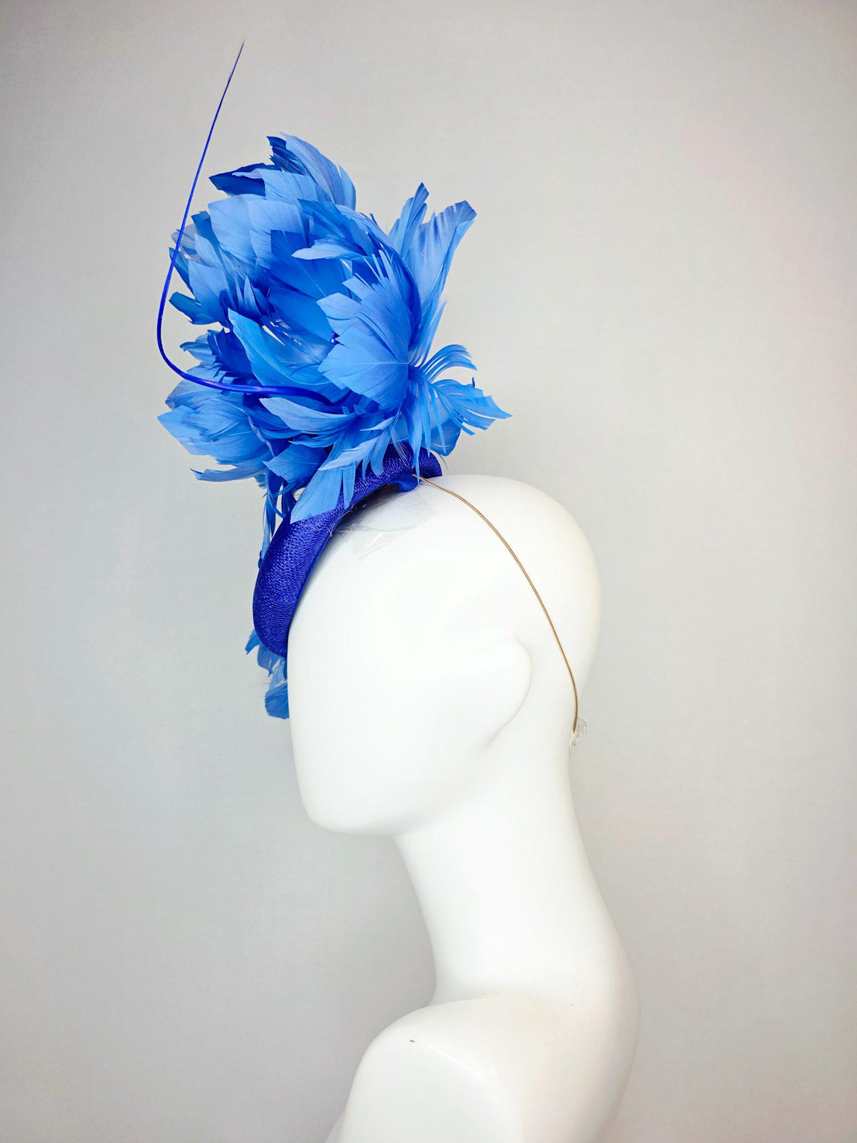kentucky derby hat fascinator royal blue sinamay with large fluffy cobalt blue feather flowers and sky blue feathers