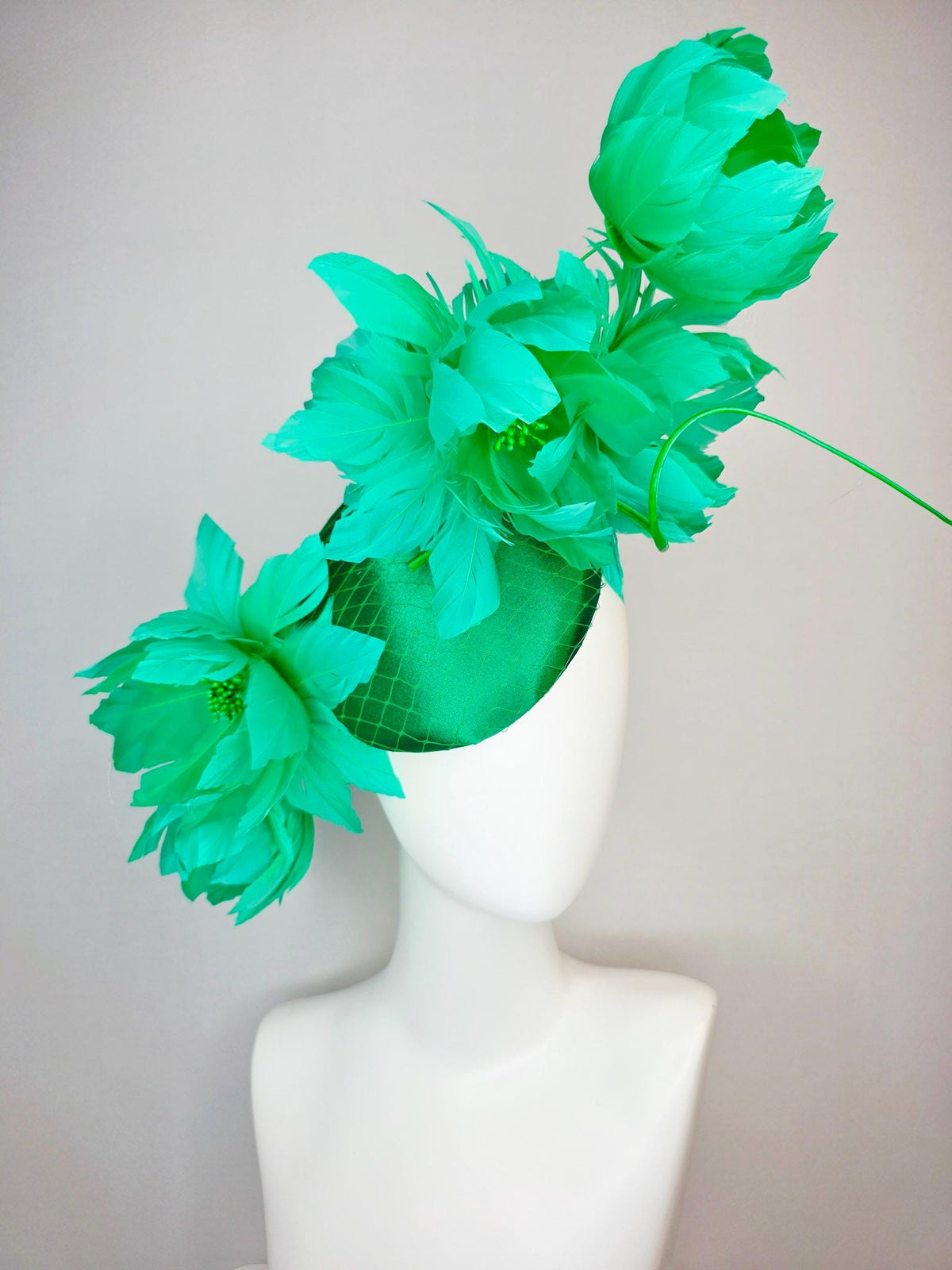 kentucky derby hat fascinator emerald green satin with netting and large fluffy green feather flowers and green feathers