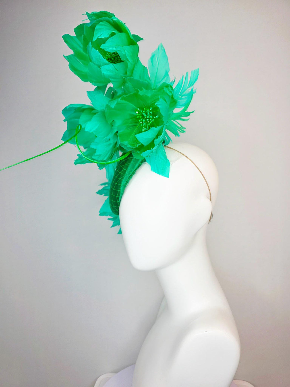 kentucky derby hat fascinator emerald green satin with netting and large fluffy green feather flowers and green feathers