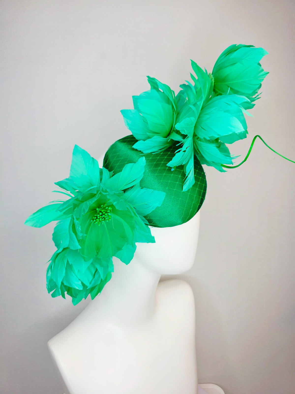 kentucky derby hat fascinator emerald green satin with netting and large fluffy green feather flowers and green feathers