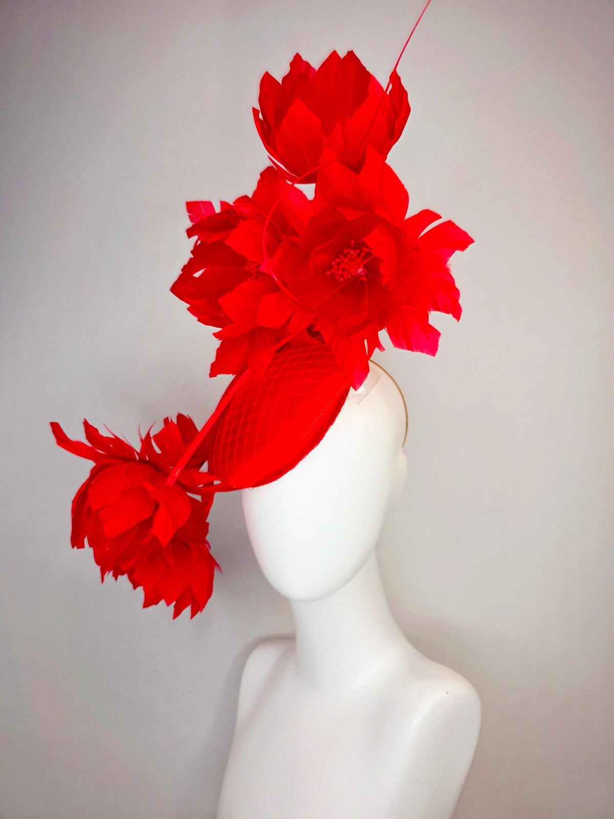 kentucky derby hat fascinator bright red satin with netting and large fluffy bright scarlet red feather flowers and red feathers
