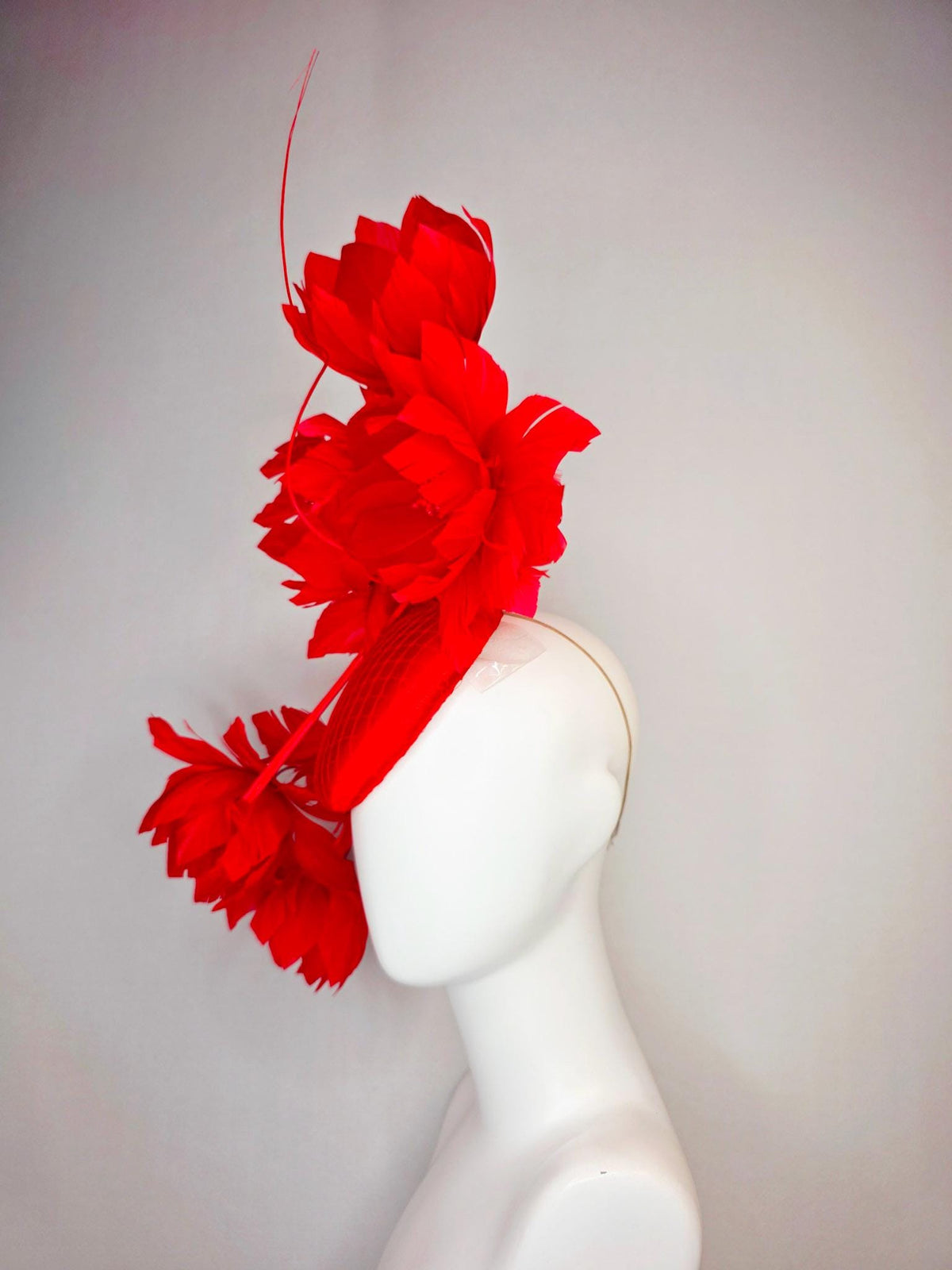 kentucky derby hat fascinator bright red satin with netting and large fluffy bright scarlet red feather flowers and red feathers