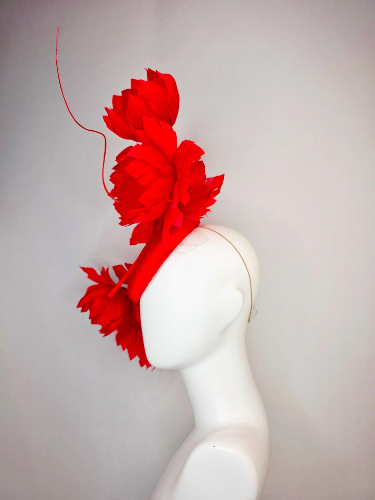 kentucky derby hat fascinator bright red satin with netting and large fluffy bright scarlet red feather flowers and red feathers