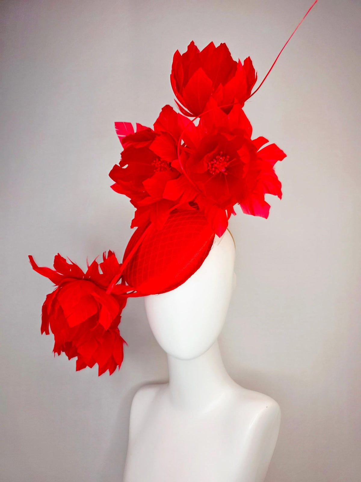kentucky derby hat fascinator bright red satin with netting and large fluffy bright scarlet red feather flowers and red feathers